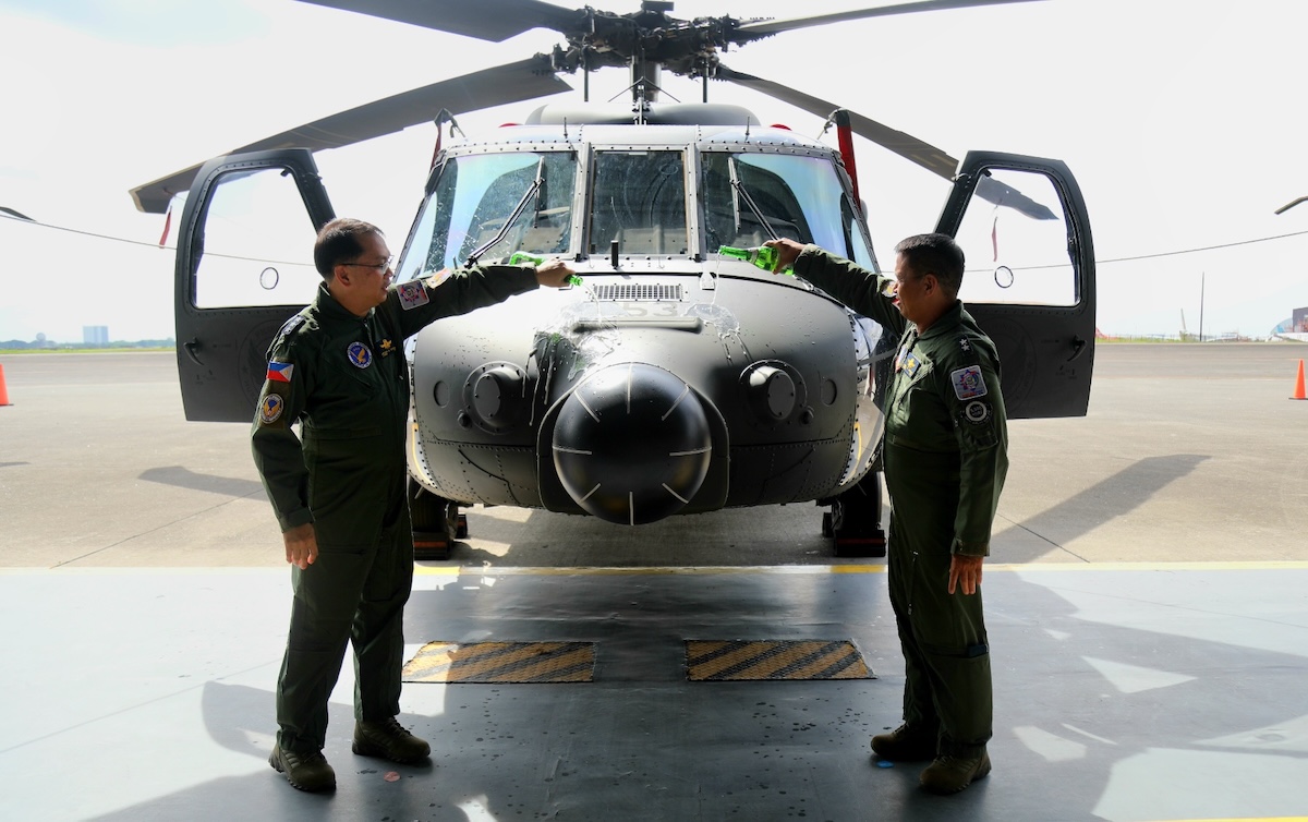LtGen Cordura and MGen Ramil G Oloroso PAF, Commander, Air Mobility Command, lead the ceremonial pouring of champagne at the five newly acquired S-70i Black Hawk helicopters on August 13, 2025 at Clark Air Base, Mabalacat City, Pampanga.