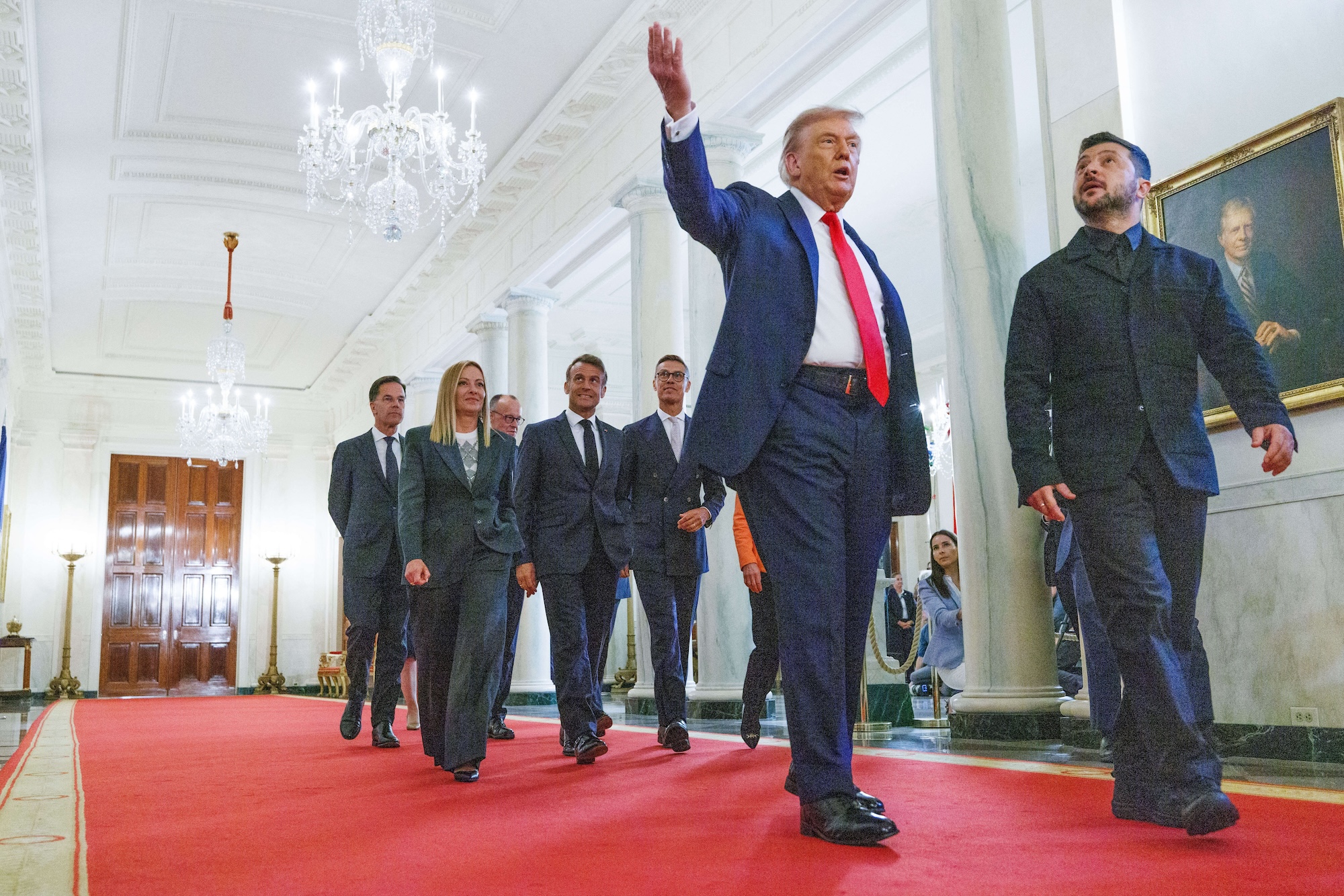 US President Donald Trump leads Ukrainian President Volodymyr Zelensky, European leaders, and NATO Secretary General Mark Rutte in Cross Hall of the White House