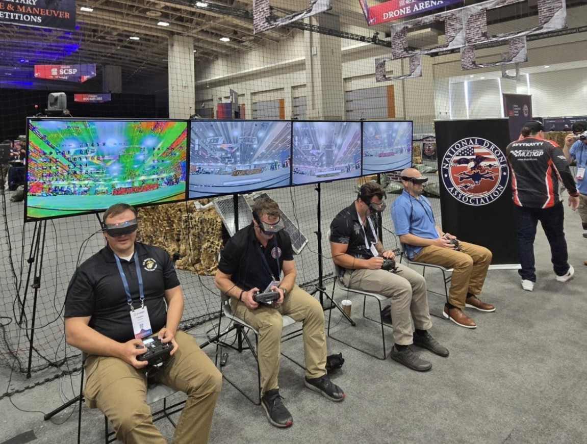 Operators from several military drone teams get set up at the AI+Expo for National Competitiveness Drone Race & Maneuver Interservice Military Competition.