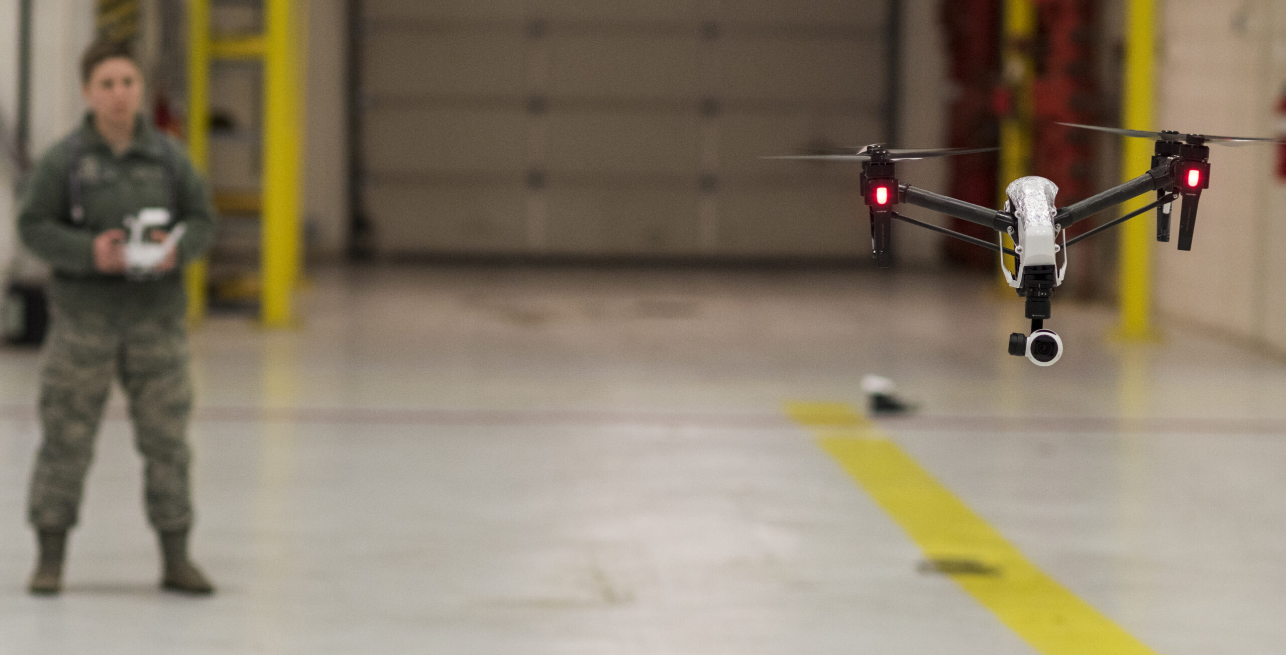 Senior Airman Madelyne Kowalczyk, 11th Security Forces Squadron counter small unmanned aircraft systems NCO in charge, operates a DJI Inspire 1 on Joint Base Andrews, Md., March 1, 2019. Small unmanned aircraft systems provide JBA defenders safer avenues in maintaining and increasing base security and daily routine activities. (U.S Air Force photo by Airman 1st Class Michael S. Murphy)