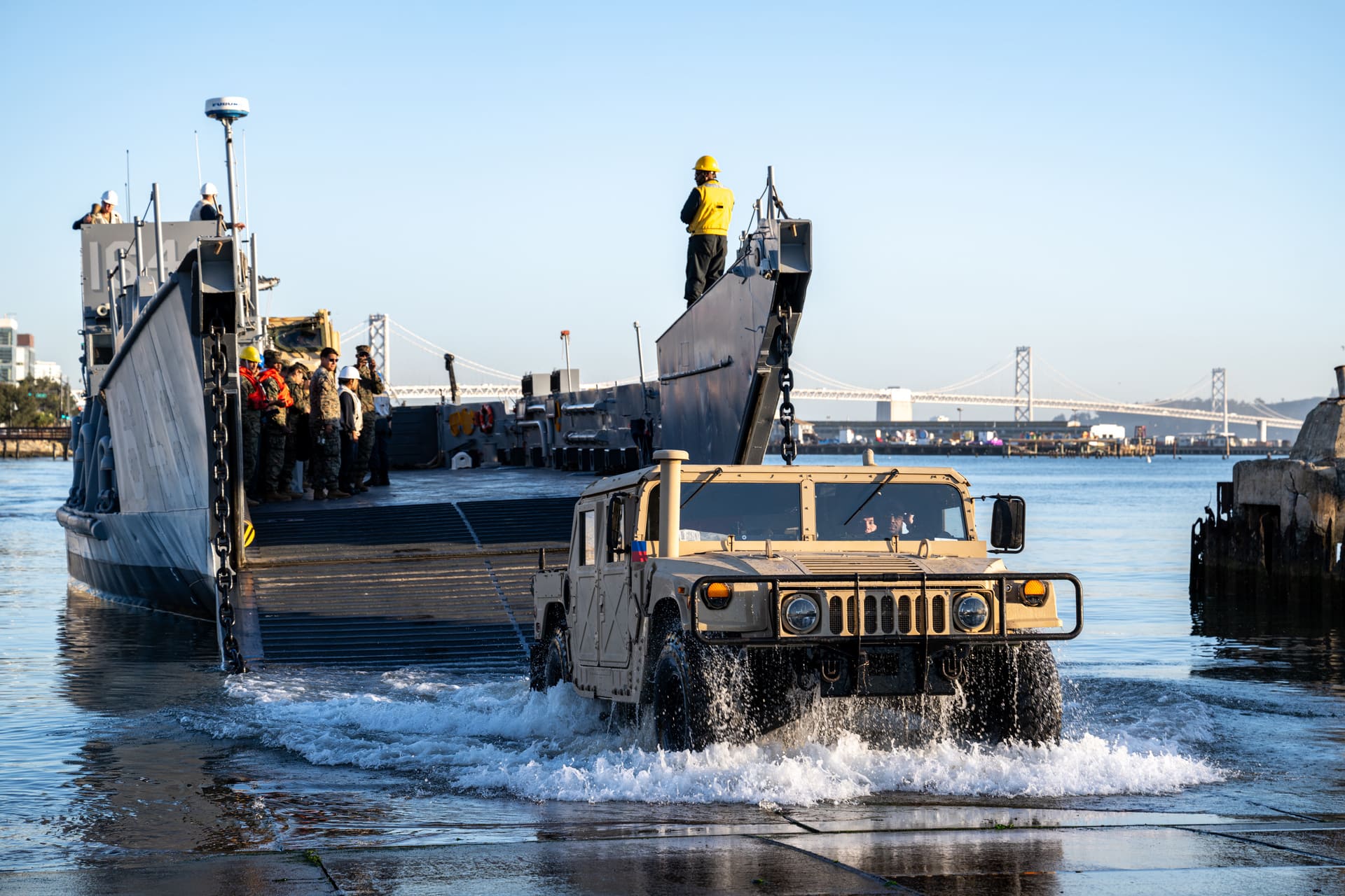 A U.S. Marine Corps Humvee assigned to Combat Logistics Battalion 13 disembarks from a landing craft, utility, assigned to Assault Craft Unit 1, in San Francisco during San Francisco Fleet Week Oct. 8, 2024. San Francisco Fleet Week, now in its 43rd iteration, is a time-honored sea service celebration that allows citizens of the Bay Area to witness today’s maritime capabilities firsthand. Nearly 2,500 Sailors, Marines, and Coast Guardsmen will showcase their capabilities and equipment, participate in various community service events, and enjoy the hospitality of the Bay Area during the event. (U.S. Navy photo by Mass Communication Specialist 2nd Class Evan Diaz)
