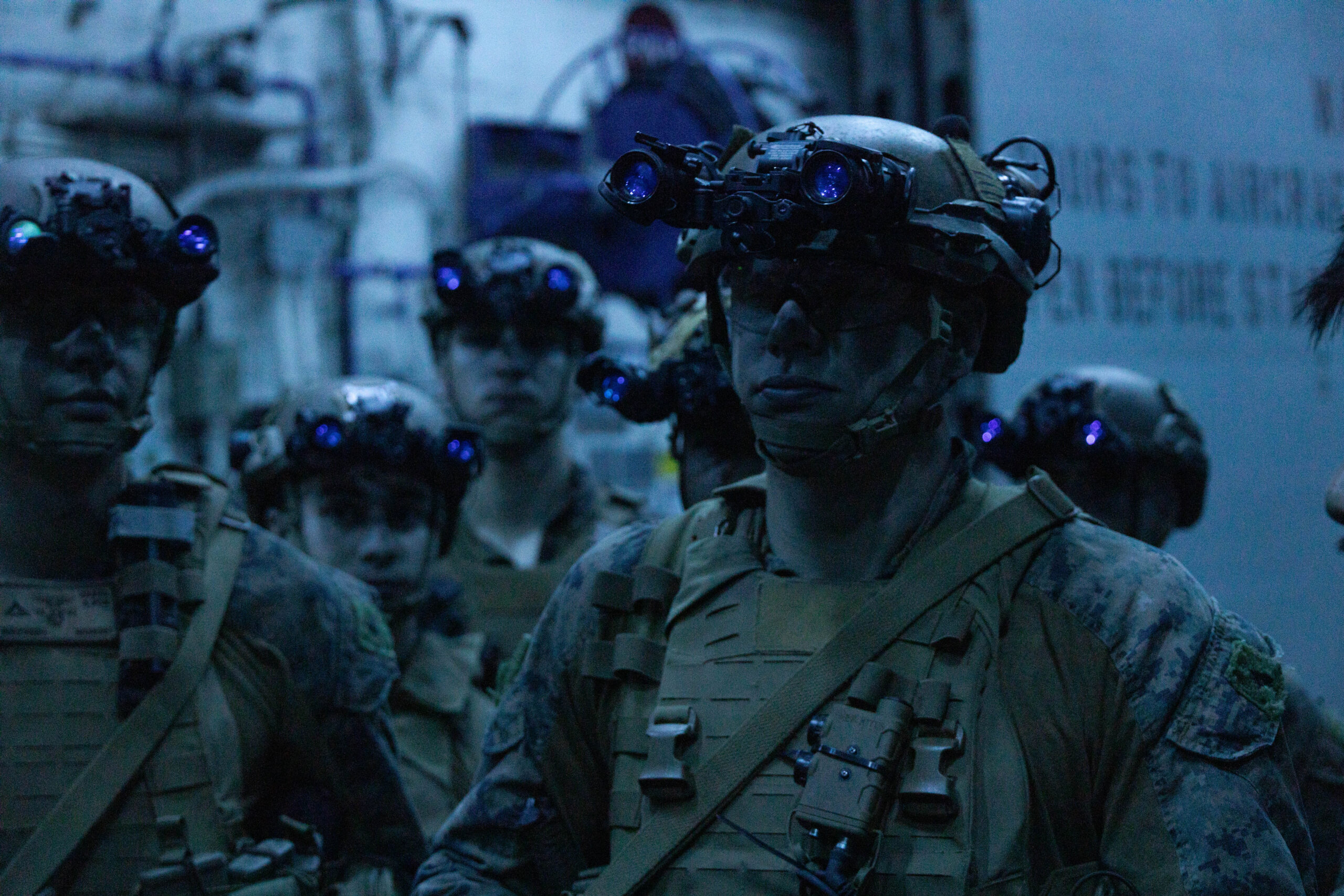 U.S. Marine Corps Cpl. Hunter Jensen, a scout with Weapons Company, Battalion Landing Team 1st Battalion, 7th Marine Regiment, 31st Marine Expeditionary Unit, waits for instructions during fast-rope training aboard amphibious assault ship USS America (LHA 6), in the Coral Sea, June 10, 2025. Marines participated in fast-rope training to enhance air-to-ground insertion capabilities for future operations. The 31st MEU is operating aboard ships of the USS America Amphibious Ready Group in the 7th Fleet area of operations, the U.S. Navy’s largest forward-deployed numbered fleet, and routinely interacts and operates with allies and partners in preserving a free and open Indo-Pacific region. Jensen is a native of Utah. (U.S. Marine Corps photo by Sgt. Peter Rawlins)