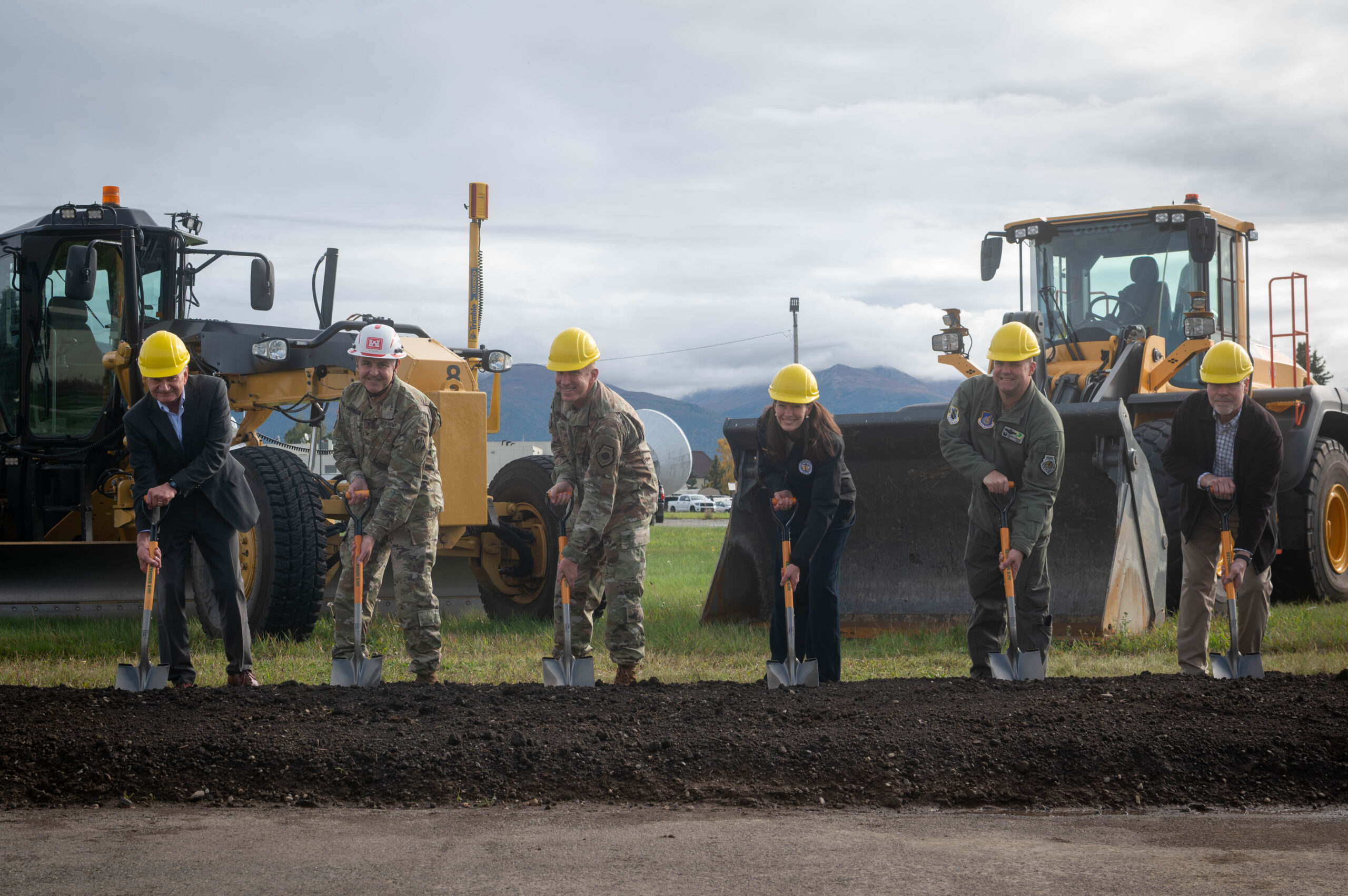 From left, Donald Weckhorst, 673rd Air Base Wing executive director, U.S. Army Col. Jeffery Palazzini, U.S. Army Corps of Engineers Alaska District commander and district engineer, U.S. Air Force Lt. Gen. Case Cunningham, Alaskan Command, Alaskan North American Aerospace Defense Command and Eleventh Air Force commander, Anchorage Mayor Suzanne LaFrance, U.S. Air Force Col. Charles Schuck, 3rd Wing commander, and Mark Prieksat, 673rd Civil Engineer Group break ground at the Joint Integrated Test and Training Center-Elmendorf groundbreaking at Joint Base Elmendorf-Richardson, Alaska, Sept. 22, 2025. The JITTC-E will ensure persistent readiness by enabling continuous, scalable training scenarios that support the development of adaptive warfighters. (U.S. Air Force photo by Senior Airman Johnny Diaz)