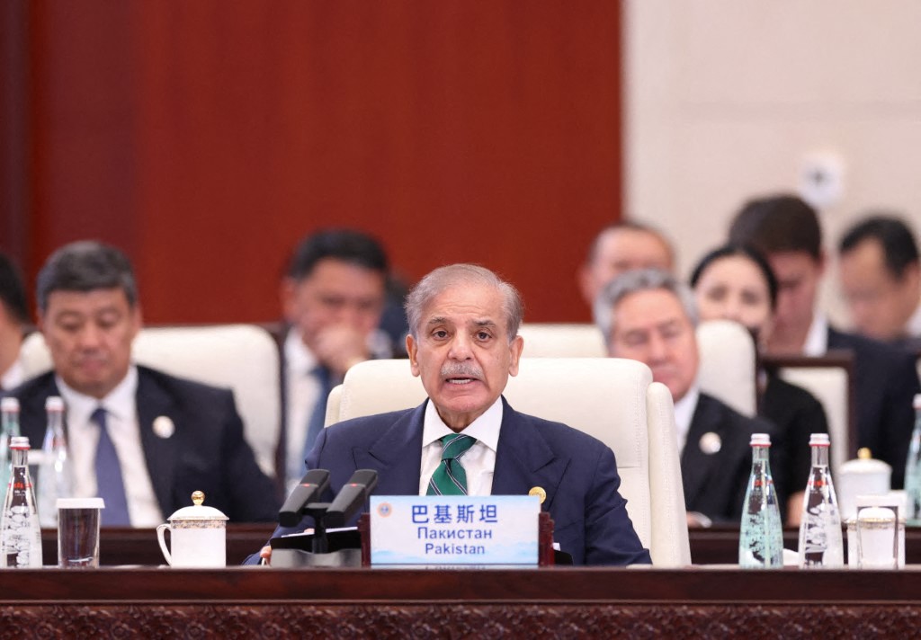 Pakistani Prime Minister Shehbaz Sharif attending a summit in China with other politicians in the background
