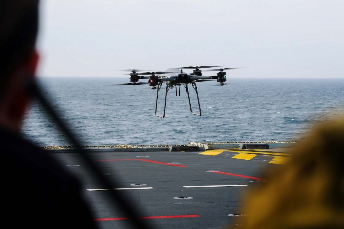 T-150 drone flying above Royal Navy warship at sea