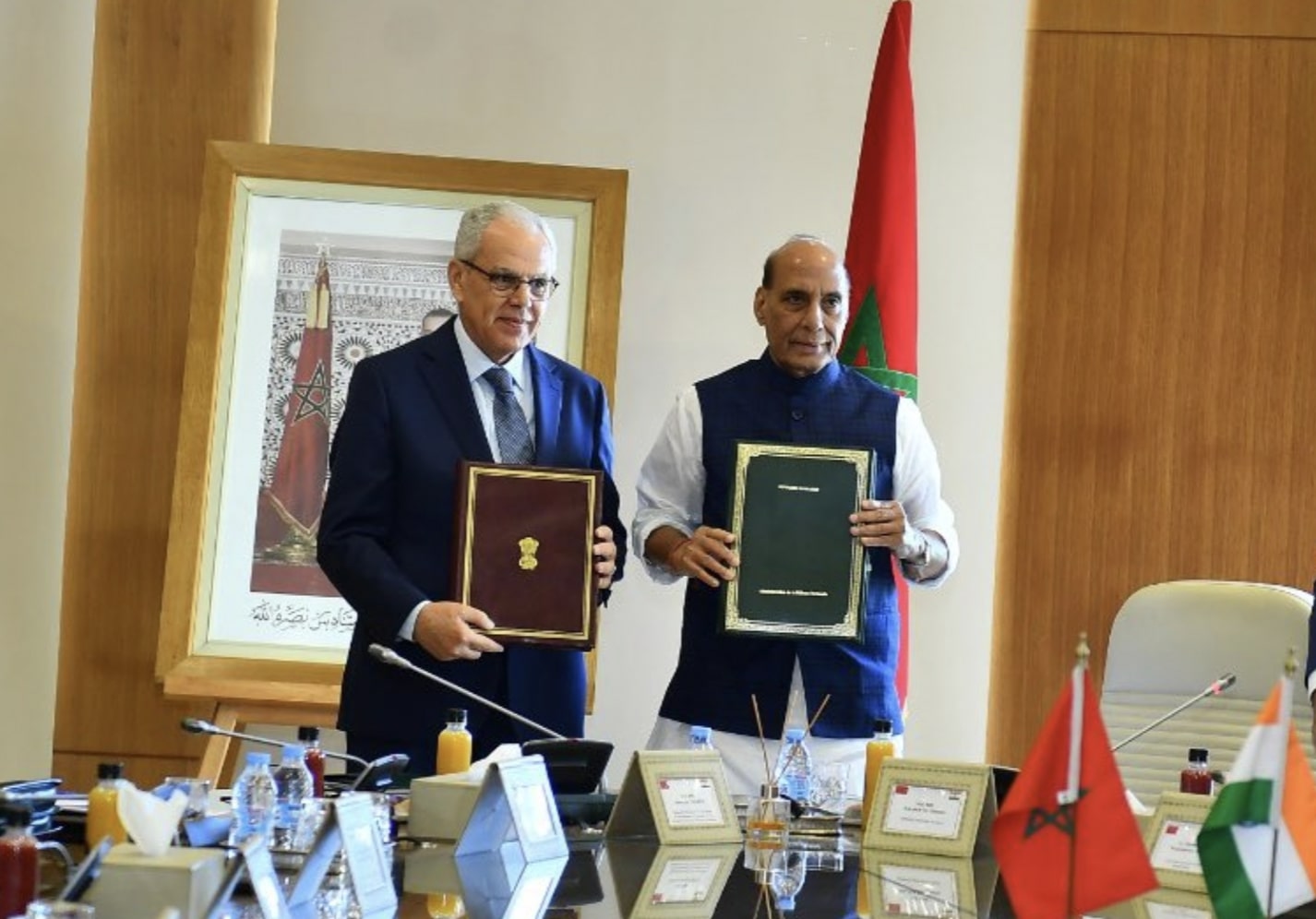 Indian Defense Minister Rajnath Singh signs defense agreement with his Moroccan counterpart Abdeltif Loudiyi.