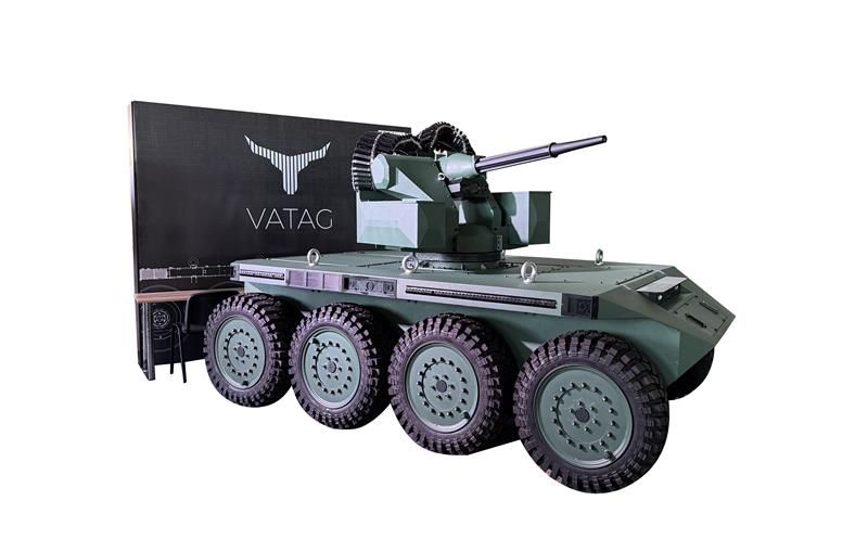 A green VATAG robotic vehicle unit against a white background