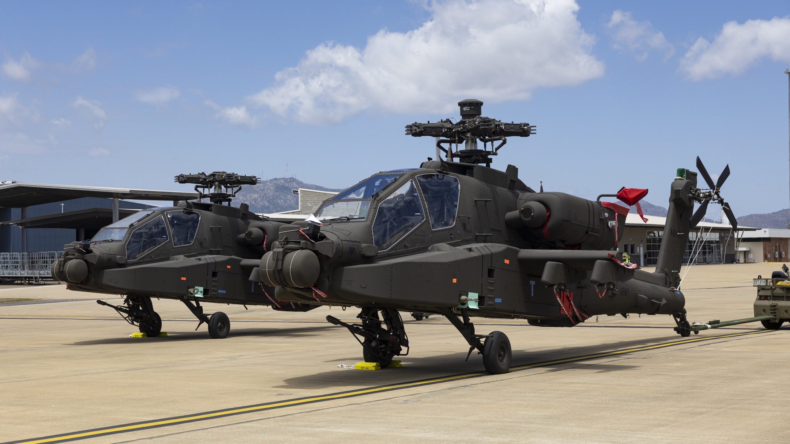 The Australian Army's first two AH-64E Apache helicopters at RAAF Base Townsville, Queensland, on 28 September 2025. *** Local Caption *** The Australian Army's first two AH-64E Apache Attack Helicopters were delivered to the 16th Aviation Brigade at RAAF Base Townsville on Sunday 28 September 2025. Defence is acquiring a fleet of 29 AH-64E Apache Attack Helicopters through a Foreign Military Sales case with the United States as part of the Project Land 4503 Apache Attack Helicopter. The AH-64E Apache will replace the Tiger Armed Reconnaissance Helicopter, bringing significant capability improvements that will enhance the lethality and tempo of land and amphibious force manoeuvres.