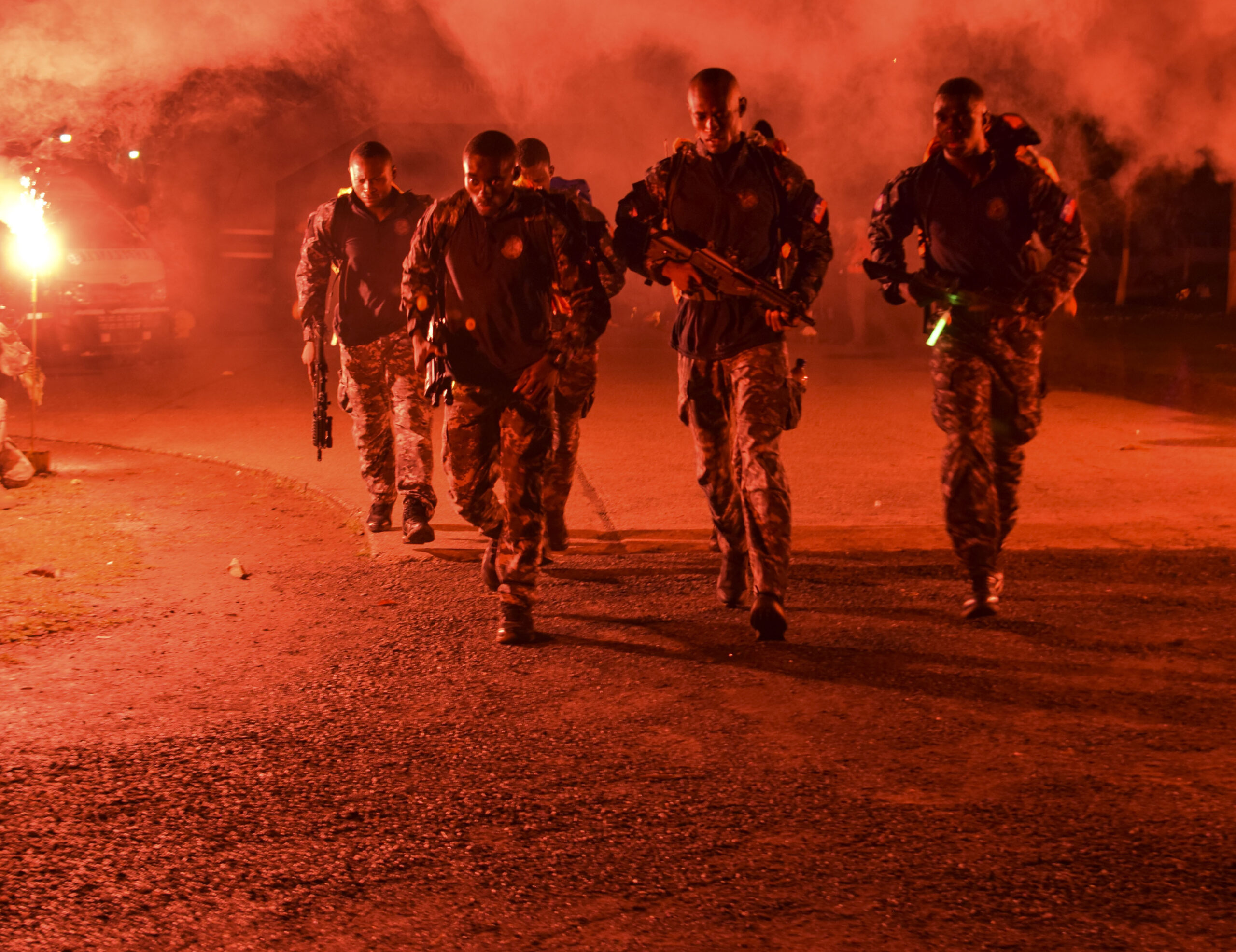Haitian comandos step off from the starting point of a 20-kilometer ruck march during Fuerzas Comando, July 17, 2018 at the Instituto Superior Policial, Panama. Fuerzas Comando is an annual multinational special operational forces skills competition sponsored by U.S. Southern Command and hosted this year by the Ministry of Public Security, Panama. Through friendly competition, this exercise promotes interoperability, military-to-military relationships, increases training knowledge, and improves regional security. (U.S. Army Photo by Staff Sgt. Brian Ragin/Released)