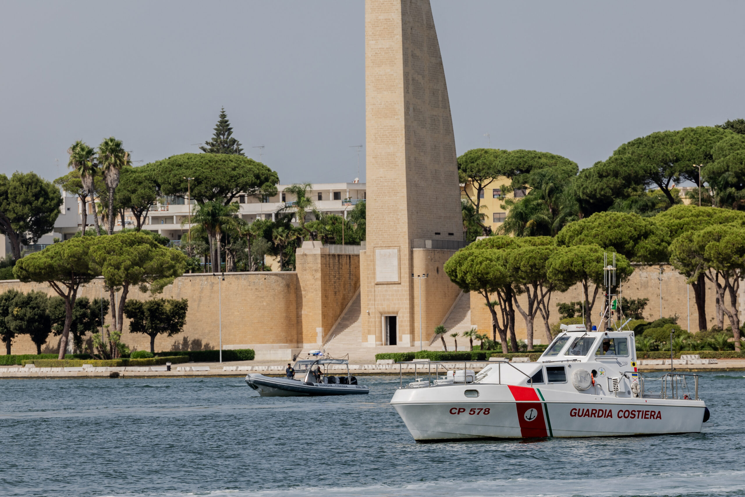 Coast Guard attend the arrival of the MSF's (Doctors Without Borders) Geo Barents ship at the Italian port of Brindisi on September 19, 2023, carrying 471 migrants, including 173 minors, one of whom was less than a year old. The migrants will be transferred to active hotspots in Puglia but also in Lombardy, Piedmont and Emilia Romagna. (Photo by Manuel Romano/NurPhoto) (Photo by Manuel Romano / NurPhoto via AFP)