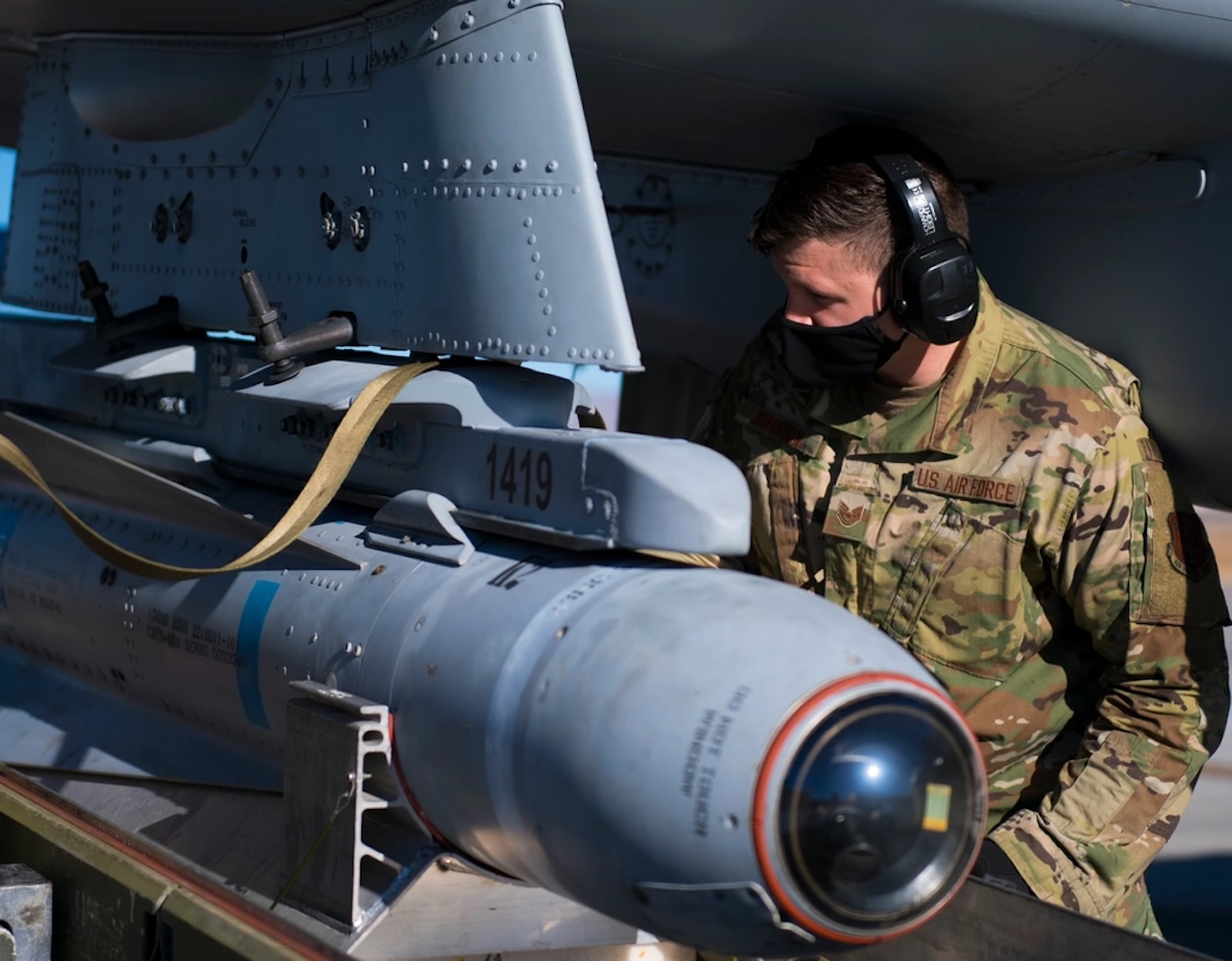 U.S. Air Force Tech. Sgt. Kacey Johnson, a weapons load crew member assigned to the 122nd Fighter Wing, Indiana Air National Guard, installs an AGM-65 Maverick missile on an A-10C Thunderbolt II aircraft during Red Flag 21-1 at Nellis Air Force Base, Nevada, Feb. 4, 2021.