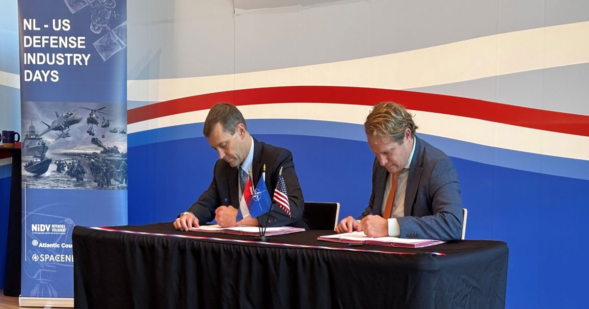 From L: GA-ASI CEO Linden Blue and Dutch Minister for Arms Procurement and Personnel Gijs Tuinman signing the deal to co-produce a small unmanned aircraft system