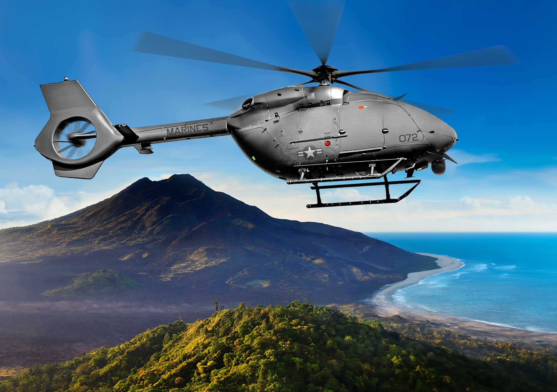 A brightly colored background with a mountainous terrain featuring the MQ-72C helicopter