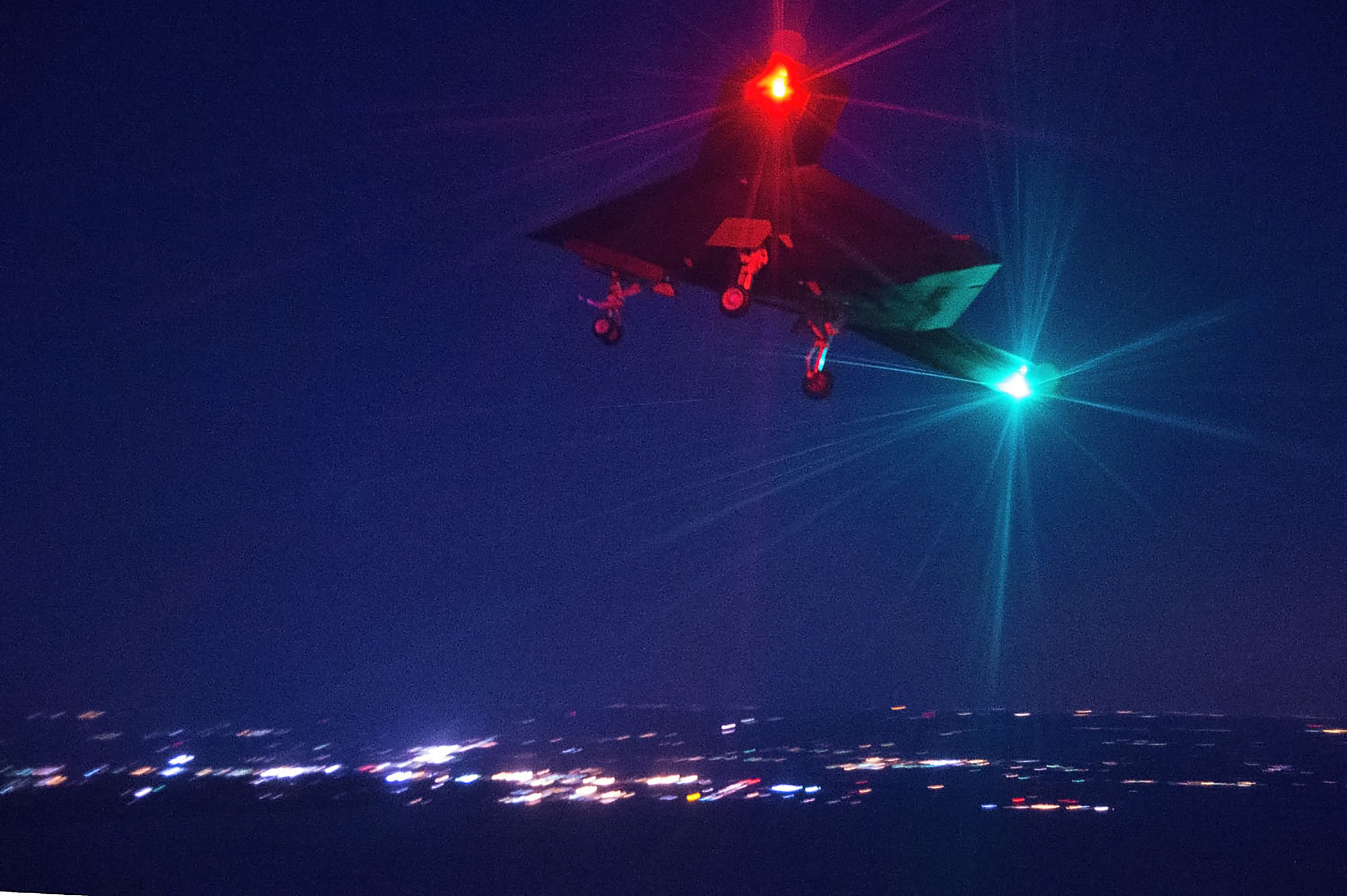 The unmanned X-47B conducts its first night flight April 10 over Naval Air Station Patuxent River, Md. Night flights are the next incremental step in developing the operations concept for more routine flight activity. The Navy will continue to execute X-47B test events to mature standard operating procedures for cooperative use of the airspace with manned aircraft. (U.S. Navy photo by Erik Hildebrandt/Released)