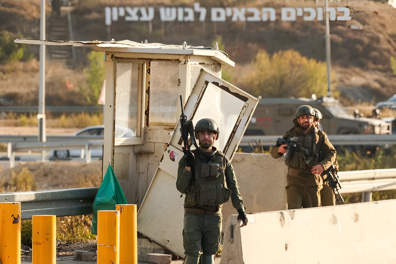 Israeli soldiers secure the site of a reported attack at the Gush Etzion Junction, in the Israeli-occupied West Bank.