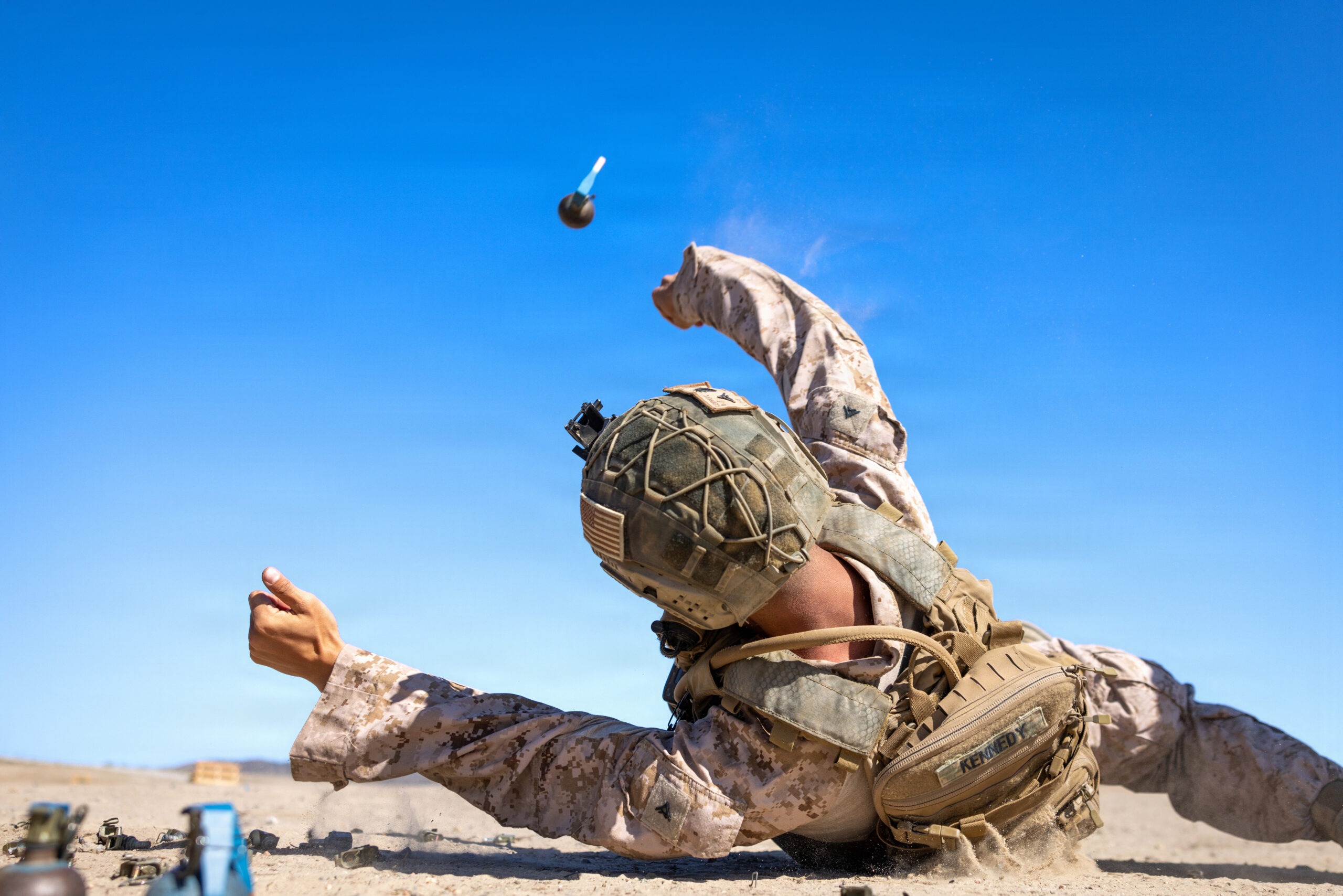 U.S. Marine Corps Lance Cpl. Bradon Kennedy, a rifleman with Kilo Company, Battalion Landing Team 3/5, 11th Marine Expeditionary Unit, throws an M67 training grenade during a live-fire range as part of MEU Exercise 26.1 on Marine Corps Base Camp Pendleton, California, Oct. 27, 2025. During MEUEX, BLT 3/5 conducted company-level training, live-fire ranges and battle drills, employing various weapon systems to maintain mission readiness. (U.S. Marine Corps photo by Sgt. Trent A. Henry)
