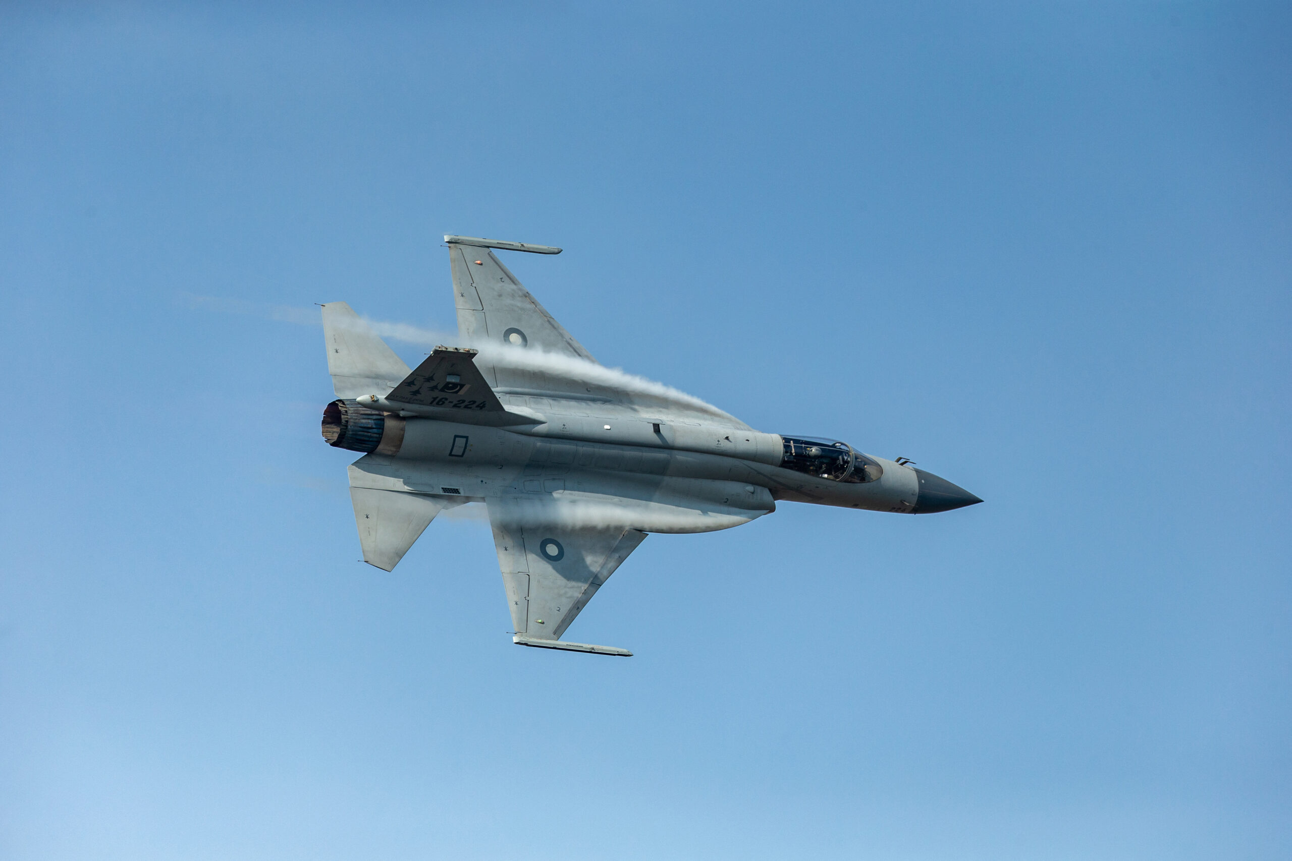 Pakistani Air Force's JF-17 Thunder (FC-1 Xiaolong or FC-1 Fierce Dragon) fighter jet performs during the 12th China International Aviation and Aerospace Exhibition, also known as Airshow China 2018, in Zhuhai city, south China's Guangdong province, 9 November 2018. JF-17 Thunder exhibited its dazzling aerial performance in front of the delegations of various air forces and aviation industries on the third day of Zhuhai Air Show in China. The breathtaking aerial display by the seasoned aerobatics pilot wing commander Zeeshan Baryar included some stunning maneuvers like the muscle climb, thunder turns, slow speed pass and inverted flight. An over fifteen minutes jaw dropping performance by Pride of The Nation, JF-17 Thunder, concluded with the trademark vertical rolls and disappearing in the blue skies of Zhuhai, leaving behind hundreds of spellbound spectators. The mesmerized audience applauded the Thundery performance as it landed back. (Photo by Shu ying / Imaginechina via AFP)