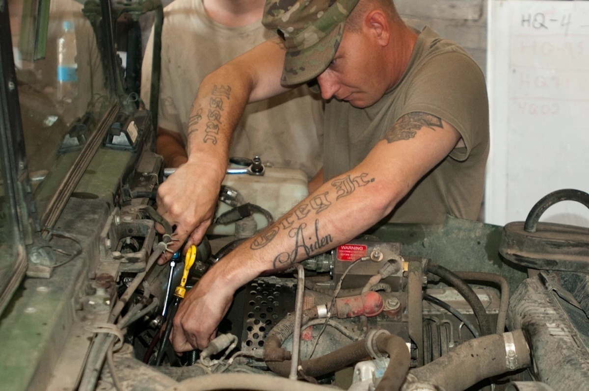 Spc. Gregory Wilson, a mechanic with Fox Company, 700th Brigade Support Battalion, 45th Infantry Brigade Combat Team, works to repair the fuel system on a Humvee while deployed in support of the Joint Multinational Training Group-Ukraine at the Yavoriv Combat Training Center on the International Peacekeeping and Security Center in Western Ukraine on Aug. 9, 2017