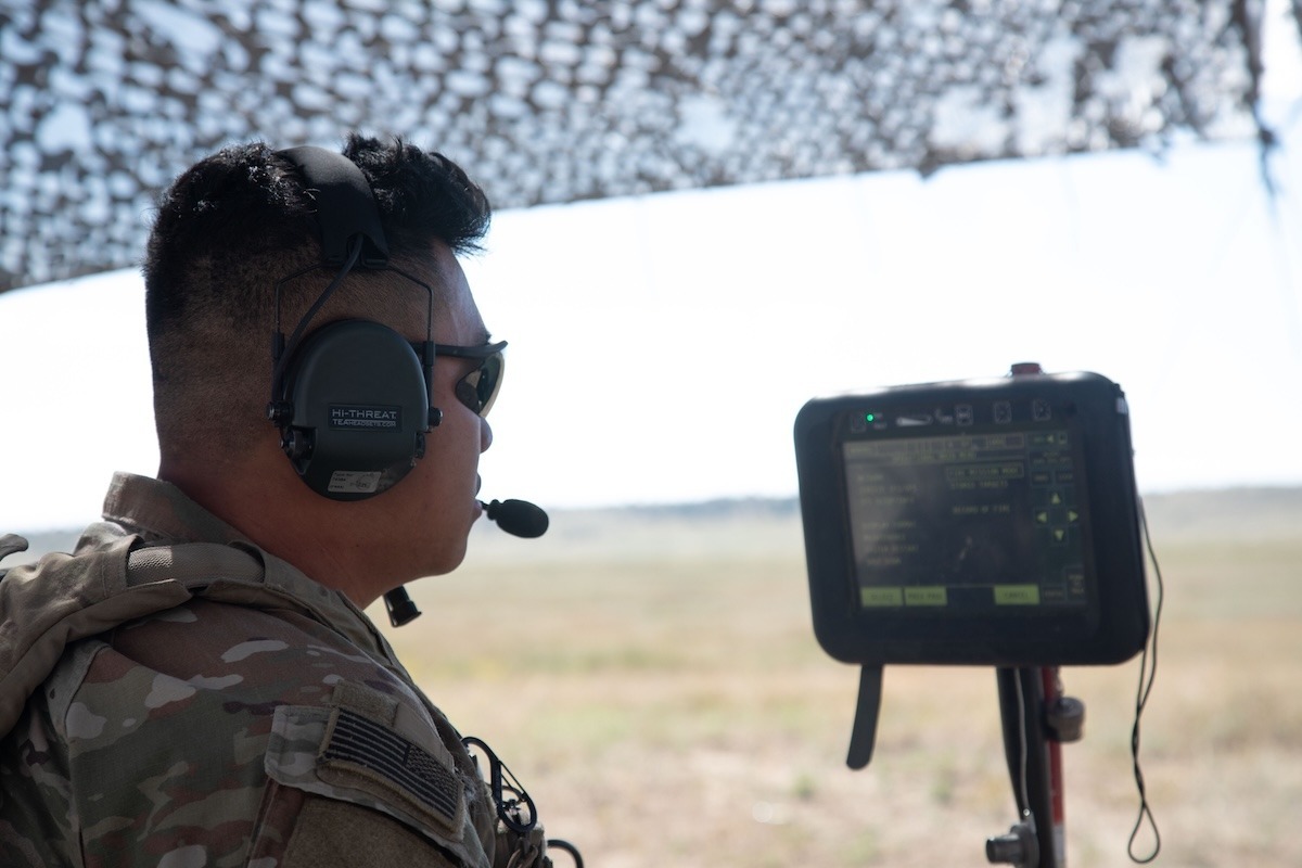 Spc. Anthony Tran, assigned to Charlie Battery, 2nd Battalion, 77th Field Artillery Regiment, Division Artillery, 4th Infantry Division, inspects the new fire control system for the M777 howitzer during Ivy Sting 1 on Fort Carson, Colo., Sept. 16, 2025.