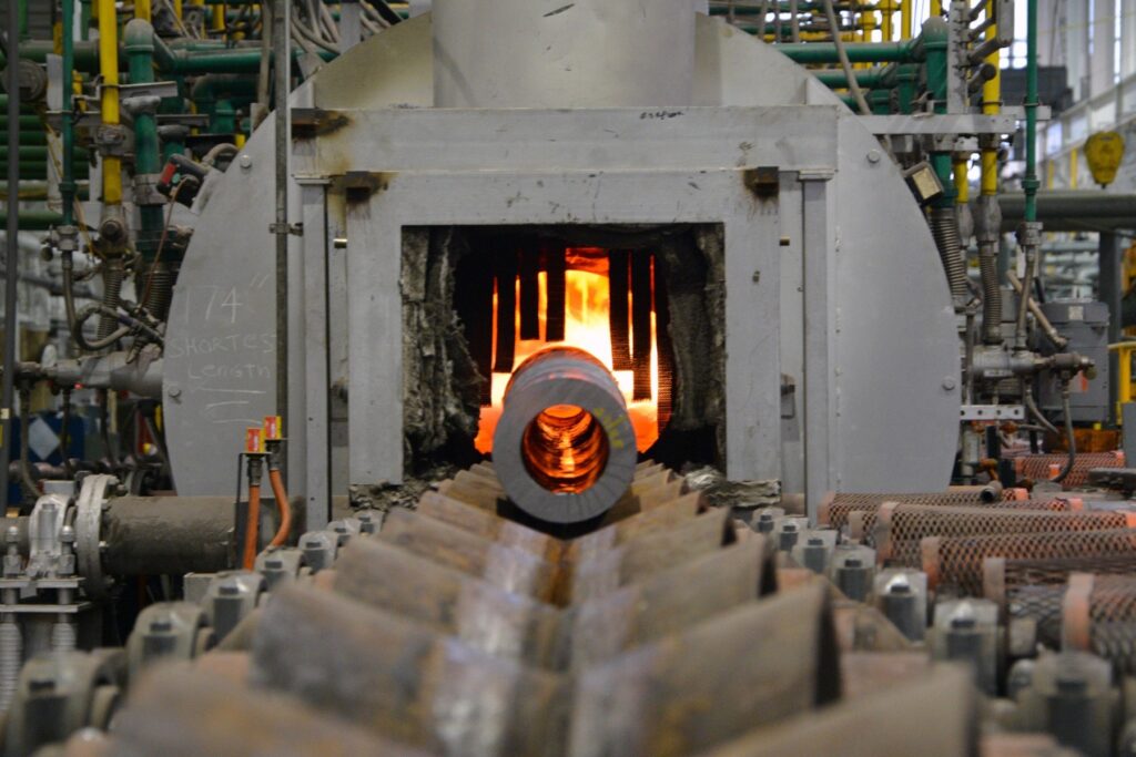 A 155 mm artillery tube enters a heat treatment furnace at Watervliet Arsenal in New York as part of a process called "austenitizing."
