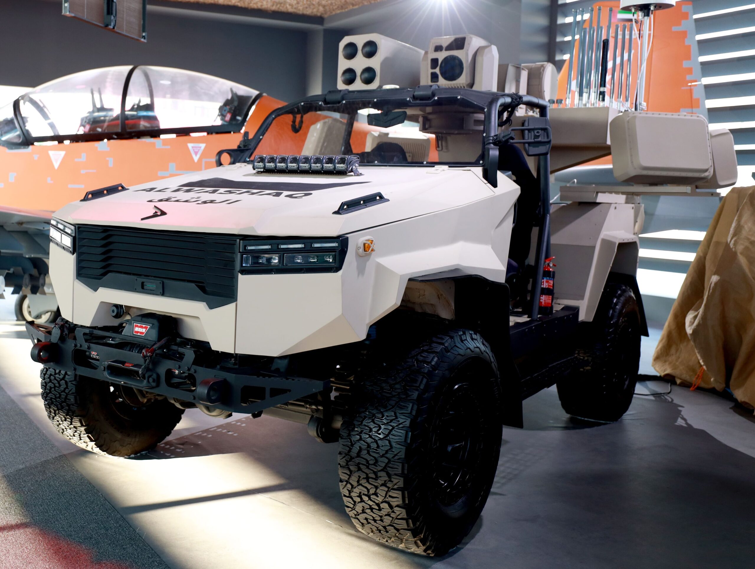 AlDeraa rapid-response system mounted on a lightweight tactical vehicle, showcasing launchers, sensors, and counter-UAS equipment at a defense exhibition