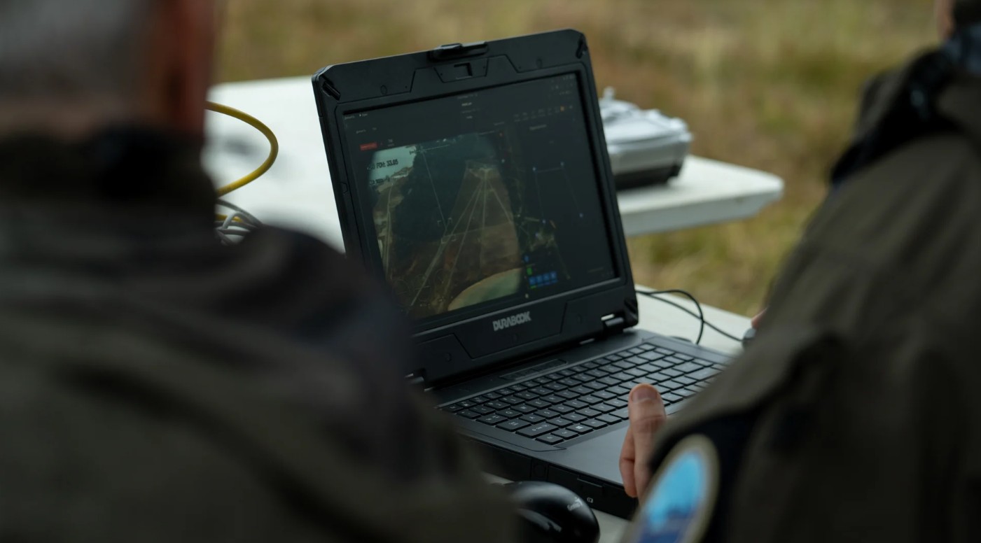 Operators sending the reconnaissance drone to map the area.