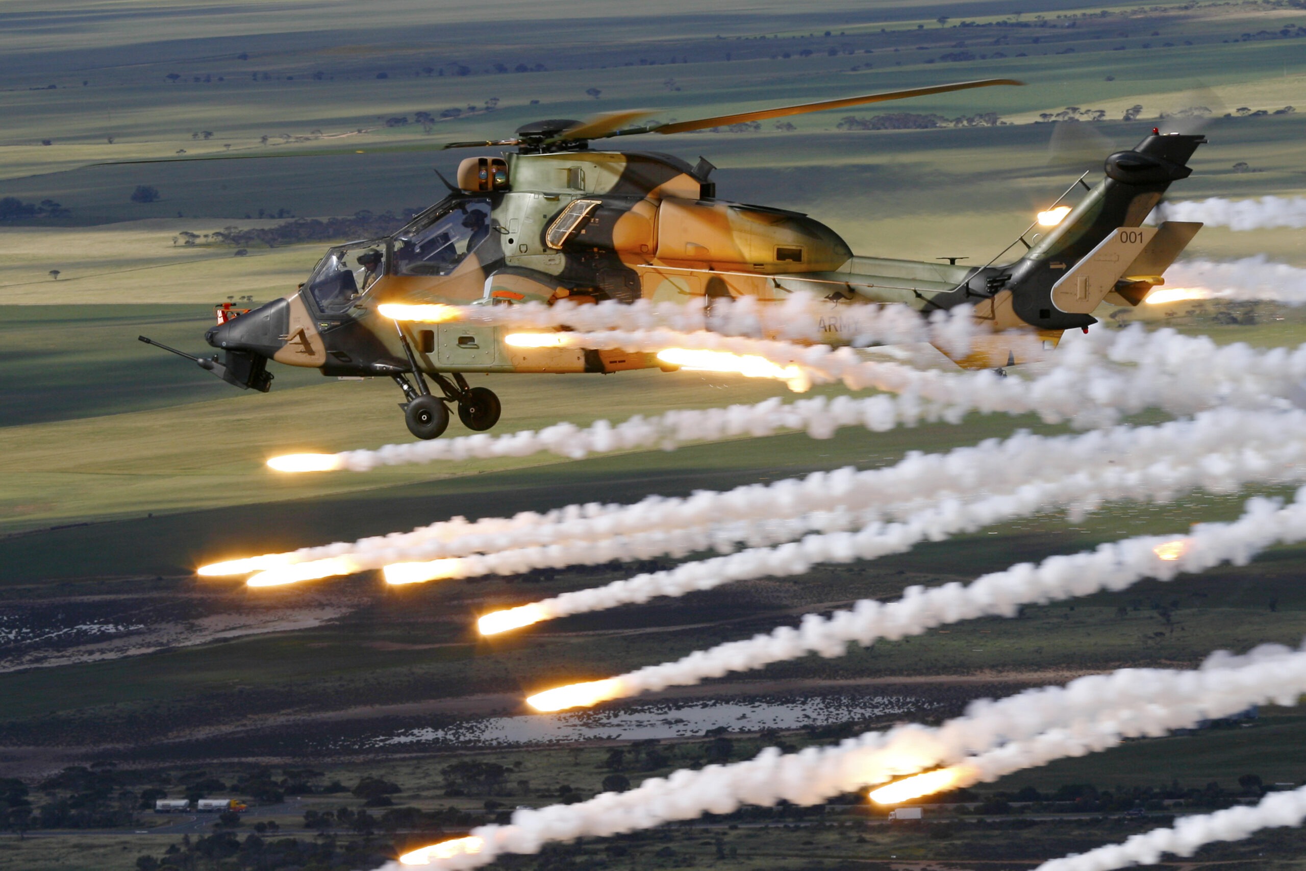 Air to Air of Tiger ARH A38-001 performing a jettison of it's Counter Measure Dispensing System. At the Port Wakefield proving ground. Trial E3032 Tiger ARH CMDS
