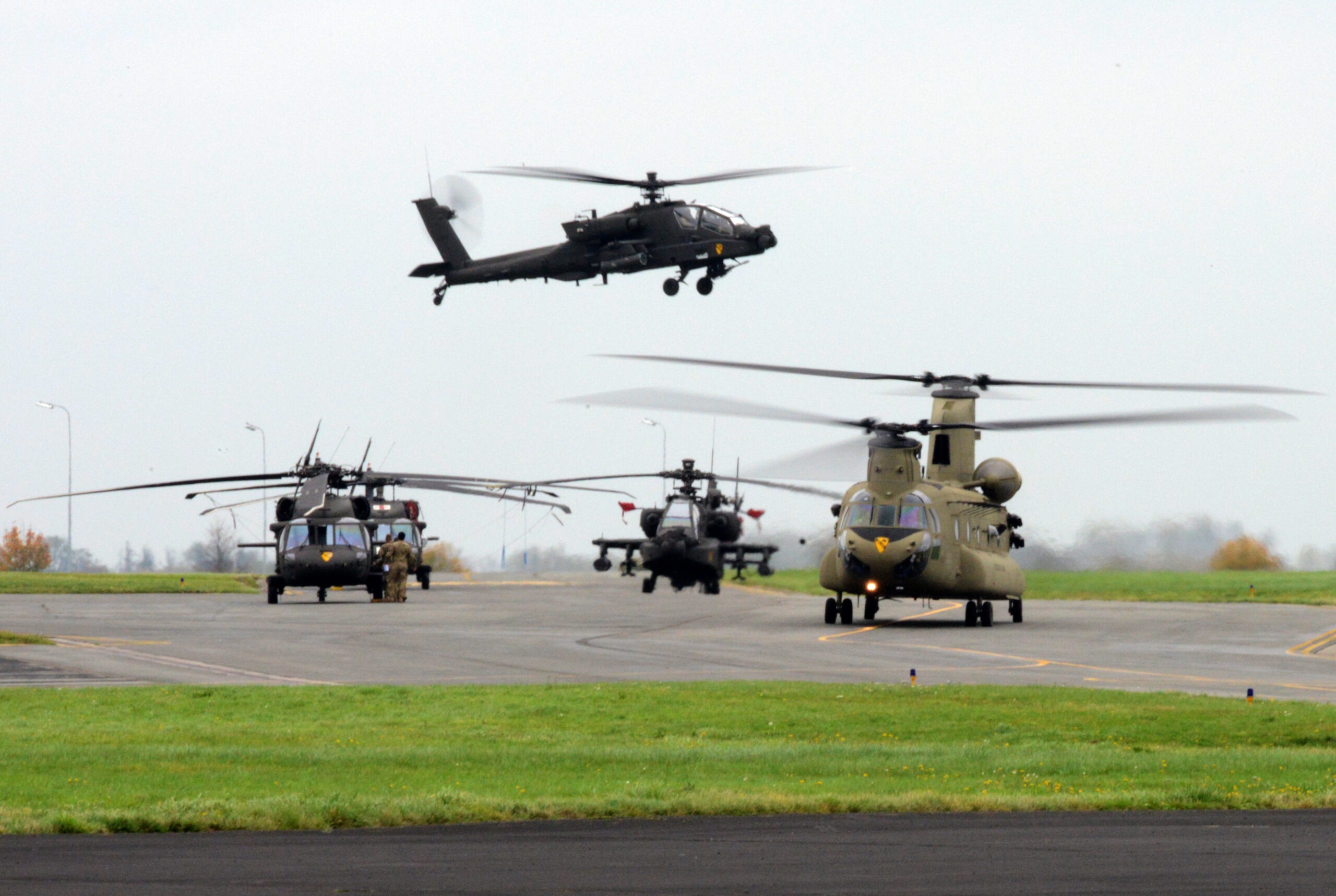 CH-47 Chinook, AH-64 Apache and UH-60 Black Hawk, assigned to 1st Air Cavalry Brigade, 1st Cavalry Division, leaves the airfield of Chièvres Air Base during the Operation Atlantic Resolve, Belgium, Oct. 25, 2017. (U.S. Army photo by Visual Information Specialist Pascal Demeuldre)