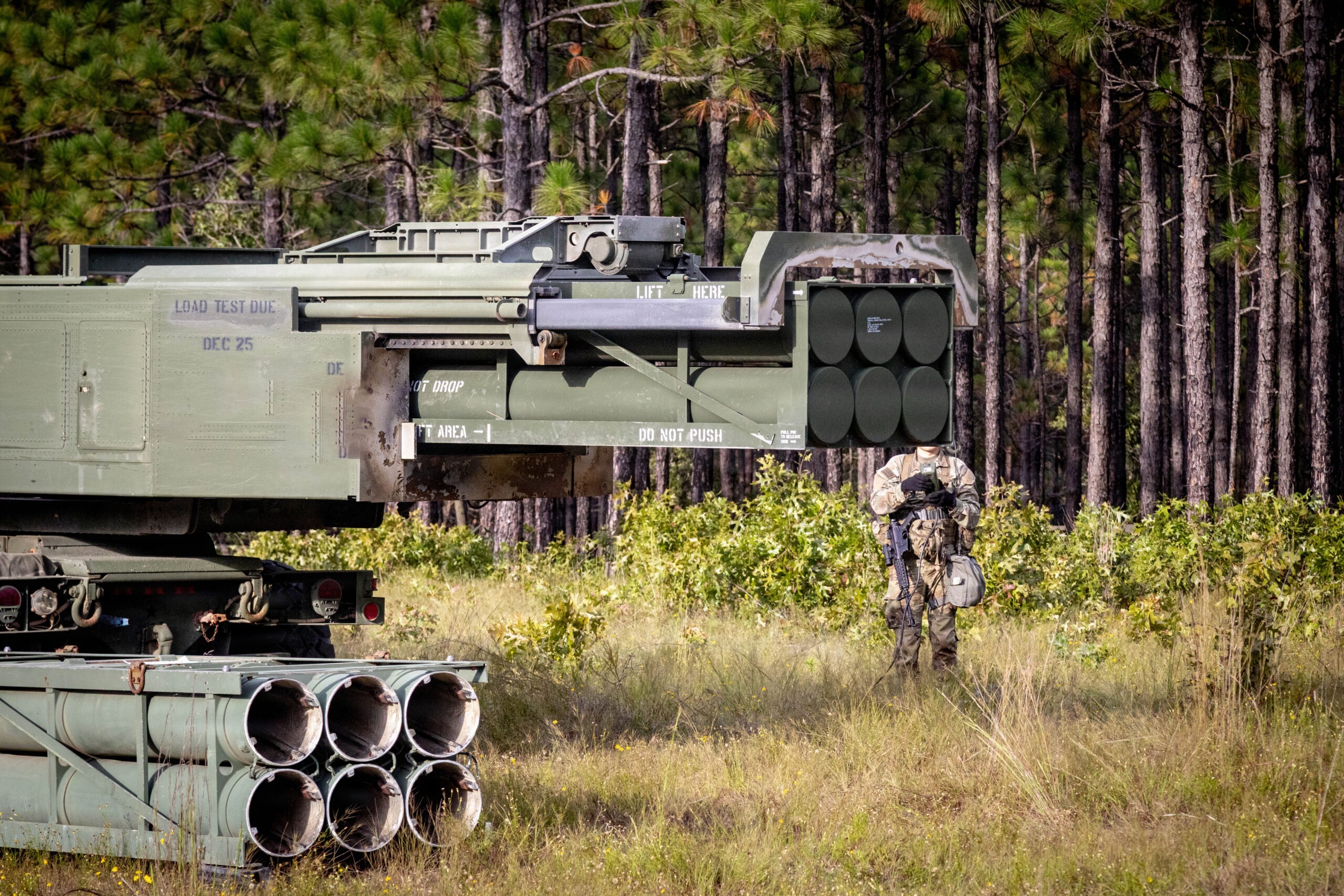A High Mobility Artillery Rocket System (HIMARS) attached to the 3-27 Field Artillery Regiment, 18th Field Artillery Brigade, dropping rocket pods during the Table XVIII Qualification on Fort Bragg, N.C., Oct. 1, 2025. Table XVIII tests a battalion's ability to coordinate and execute multiple live-fire missions, integrating the capabilities of all its batteries under realistic, often high-stress conditions. (U.S. Army photo by Sgt. Austin Robertson)