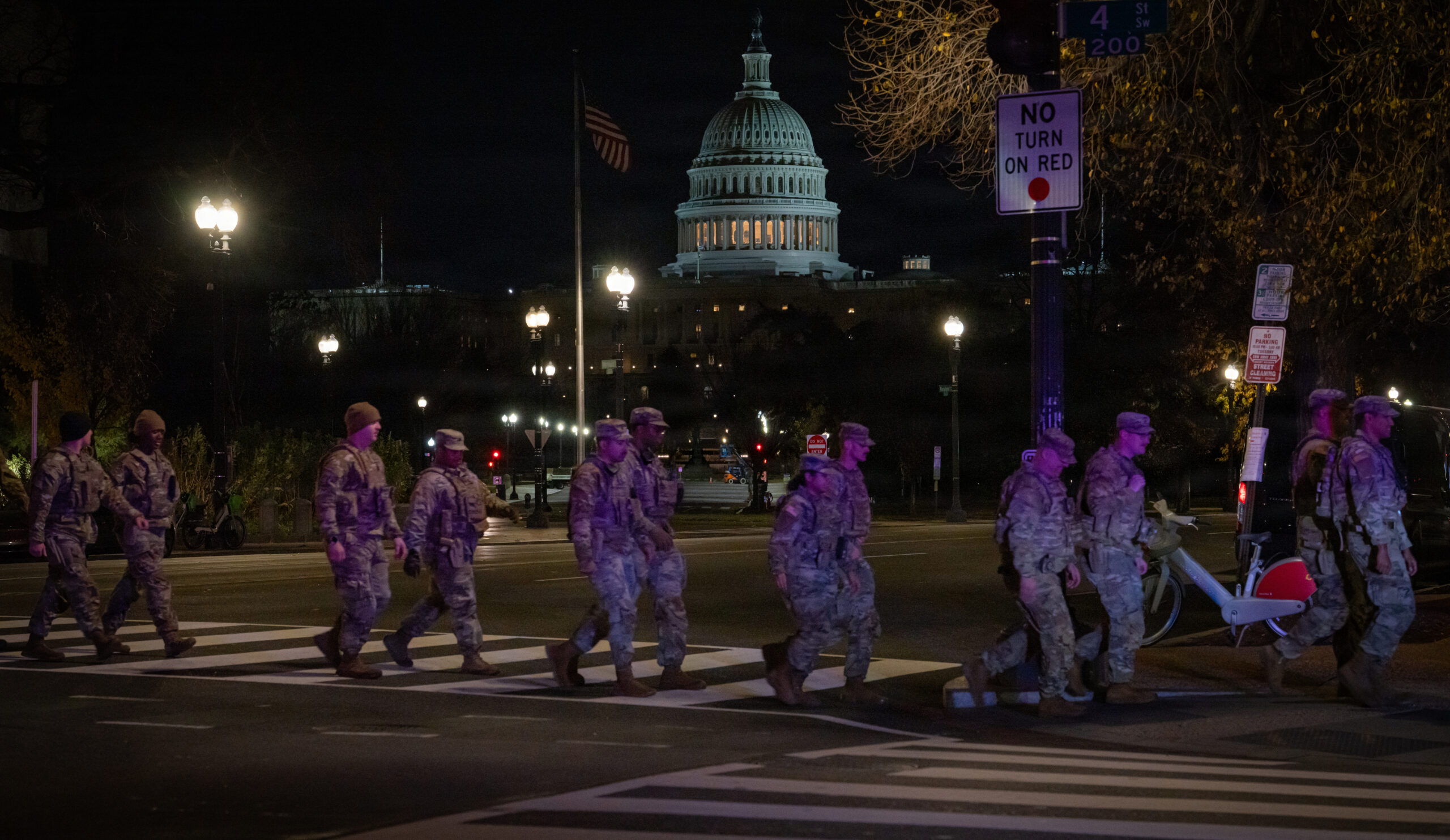 U.S. service members line the streets of Washington, D.C., during an honor escort—also known as a fallen soldier procession—for U.S. Army Spc. Sarah Beckstrom of the West Virginia National Guard, Nov. 27, 2025. The tradition honors fallen soldiers with silent, unified respect as they are escorted to their final resting place. (U.S. Army National Guard photo by Sgt. Angelina Tran)