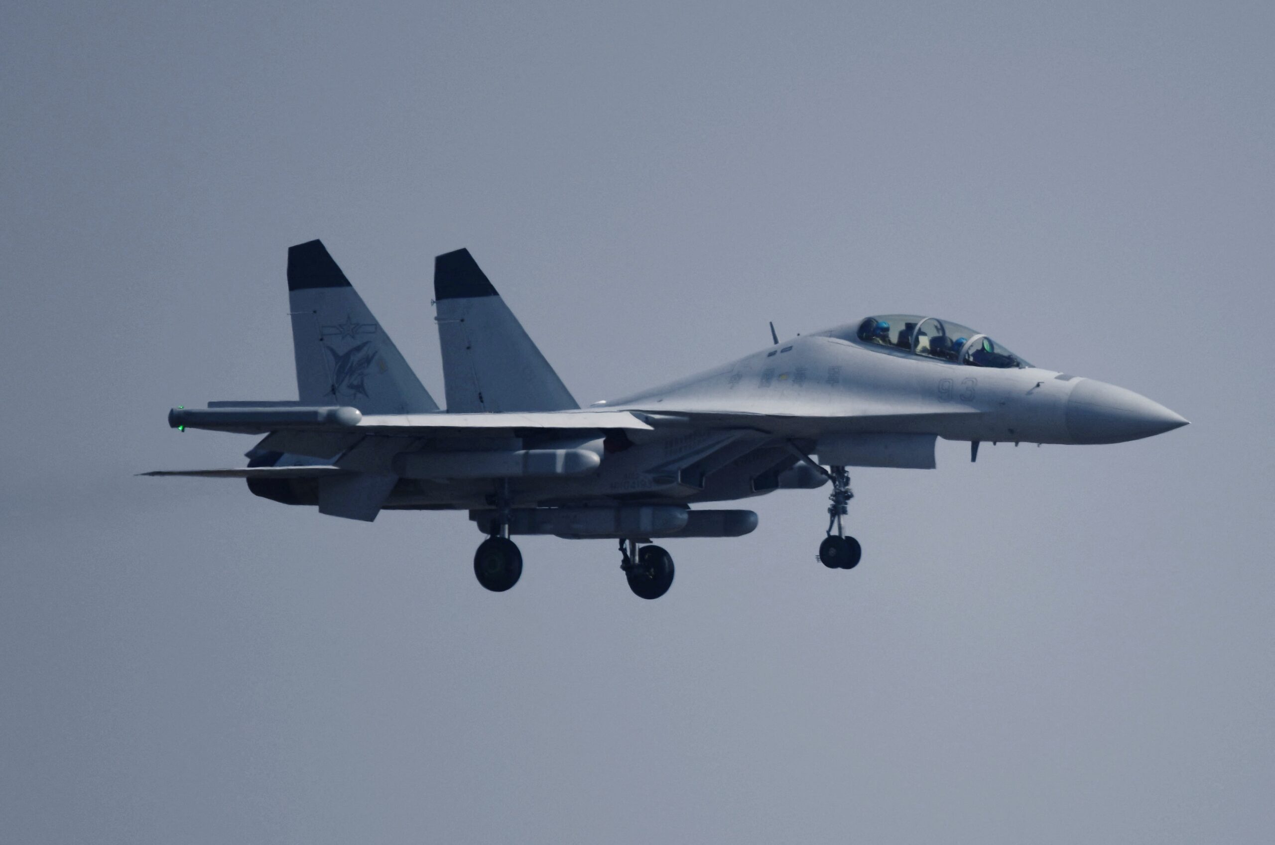 In Zhuhai, China, on November 12, 2024, J-15 series carrier-based aircraft perform a flight during The 15th China International Aviation and Aerospace Exhibition in Zhuhai, Guangdong province, China. On the same day, the Navy J-15 series carrier-based aircraft formation, composed of 1 J-15D aircraft and 2 J-15T aircraft, conducts a flight demonstration over Zhuhai Jinwan Airport. (Photo by Costfoto/NurPhoto) (Photo by CFOTO / NurPhoto via AFP)