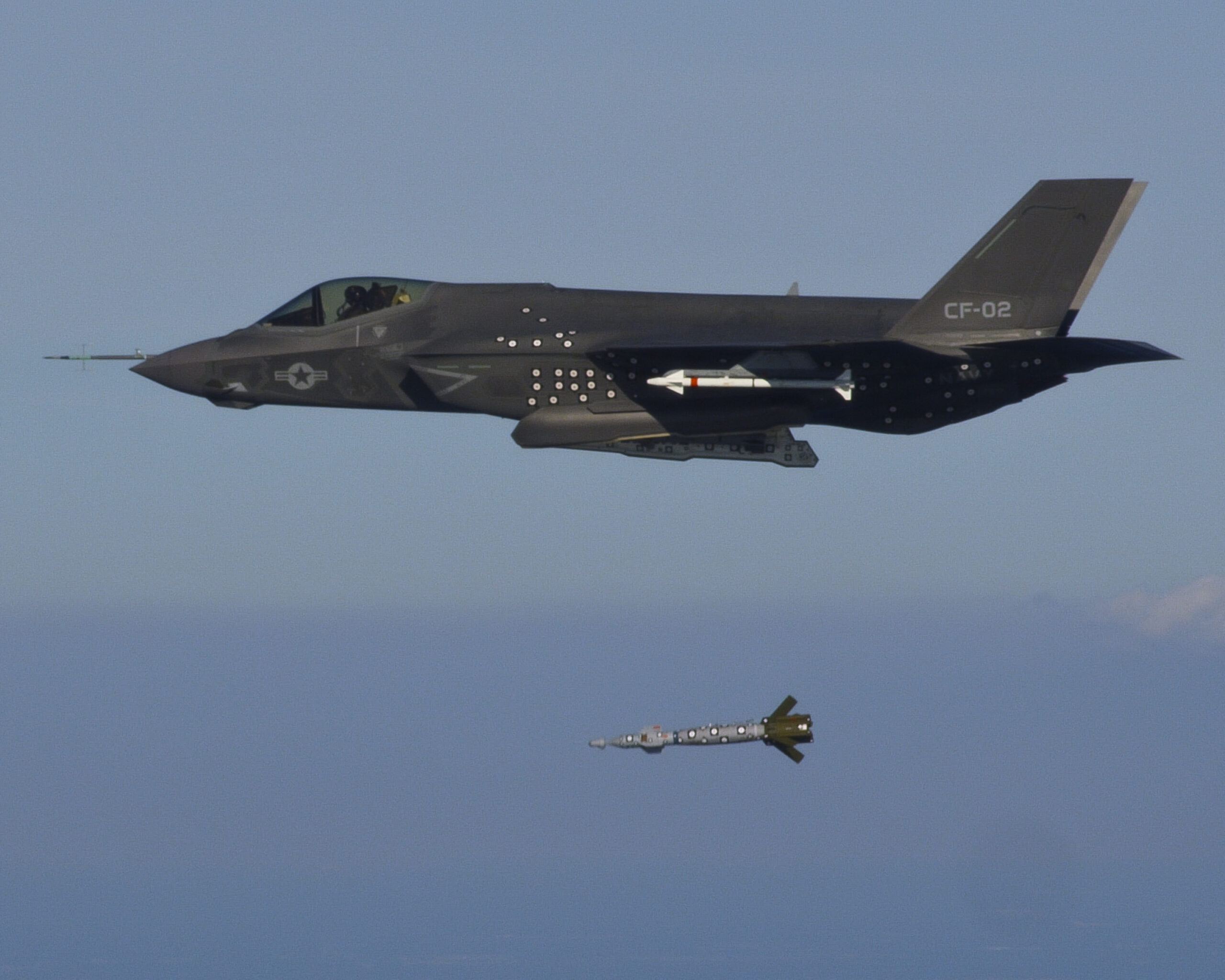 The F-35C Lightning II Joint Strike Fighter performs the first F-35C weapon separation by releasing the 500-pound inert Guided Bomb Unit (GBU) 12 over an Atlantic test range