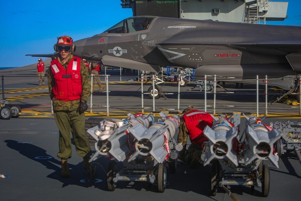Cpl Charlton Hale with Marine Fighter Attack Squadron 211 prepares to transport Guided Bomb Unit (GBU) 12 Paveway II’s to an F-35B Joint Strike Fighter on the flight deck of Her Majesty’s Ship Queen Elizabeth