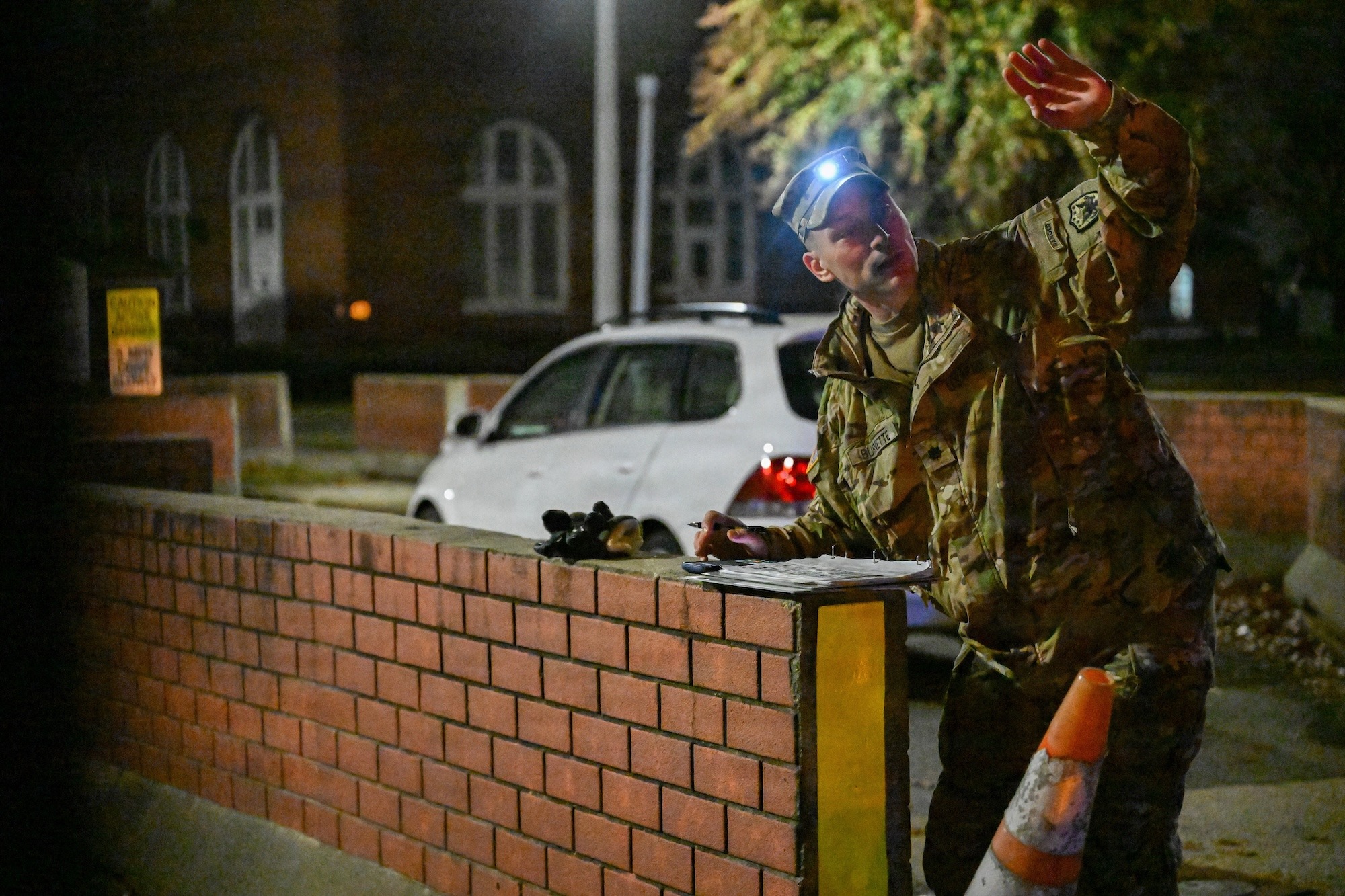 US serviceman observes drone activity in the night sky and records notes during a counter-drone exercise Washington, DC
