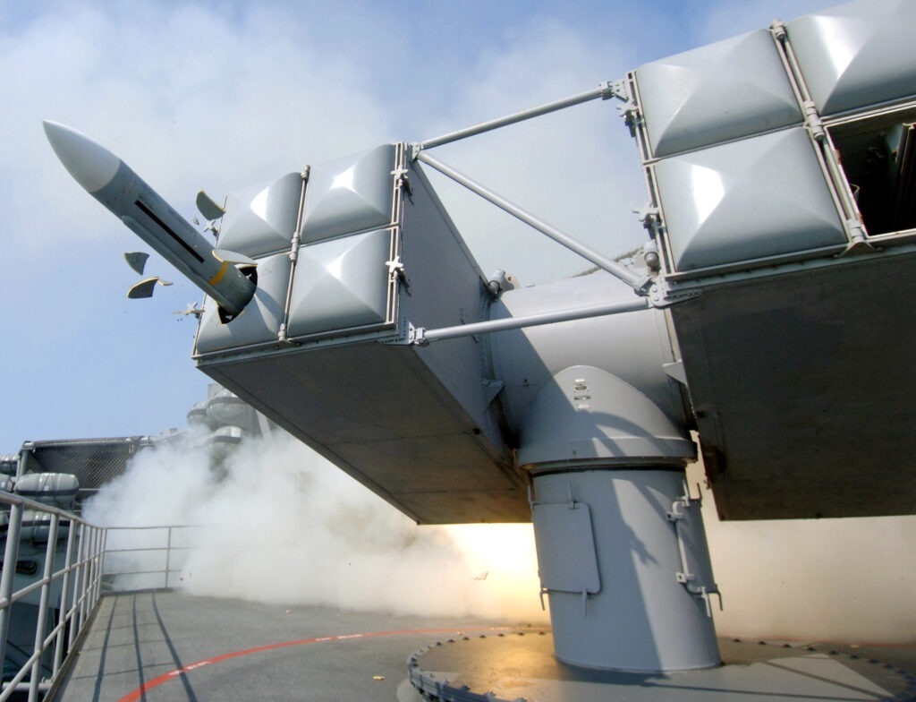 A NATO Sea Sparrow (RIM-7) missile blasts through its foam launcher cover during a shipboard self-defense exercise on board Nimitz-class aircraft carrier USS Harry S. Truman