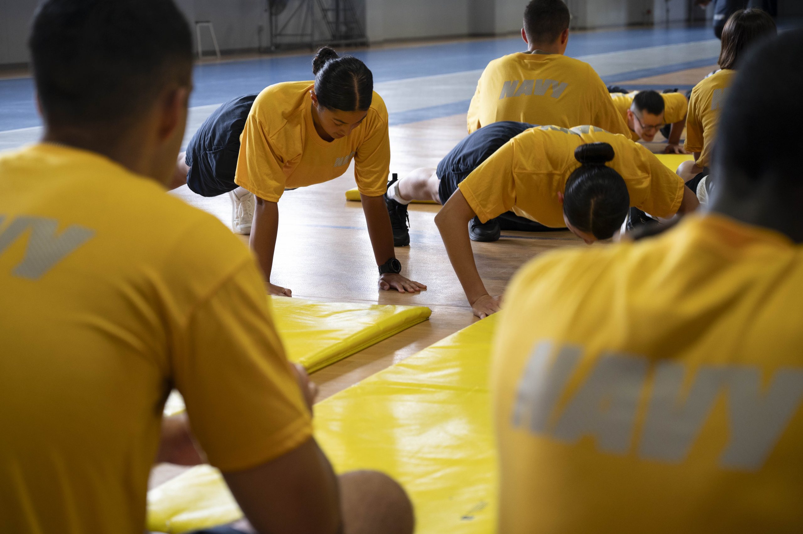 250818-N-MK109-1014 GREAT LAKES, Ill. (Aug. 18, 2025) Recruits participate in their physical fitness assessment (PFA) at Freedom Hall onboard Recruit Training Command (RTC). PFAs are conducted during boot camp to ensure future Sailors are prepared for the physical demands of the fleet. Training at RTC is approximately nine weeks, and all enlistees in the U.S. Navy begin their careers at the command. More than 40,000 recruits train annually at the Navy's only boot camp. (U.S. Navy photo by Mass Communication Specialist 2nd Class Mykala Keckeisen)