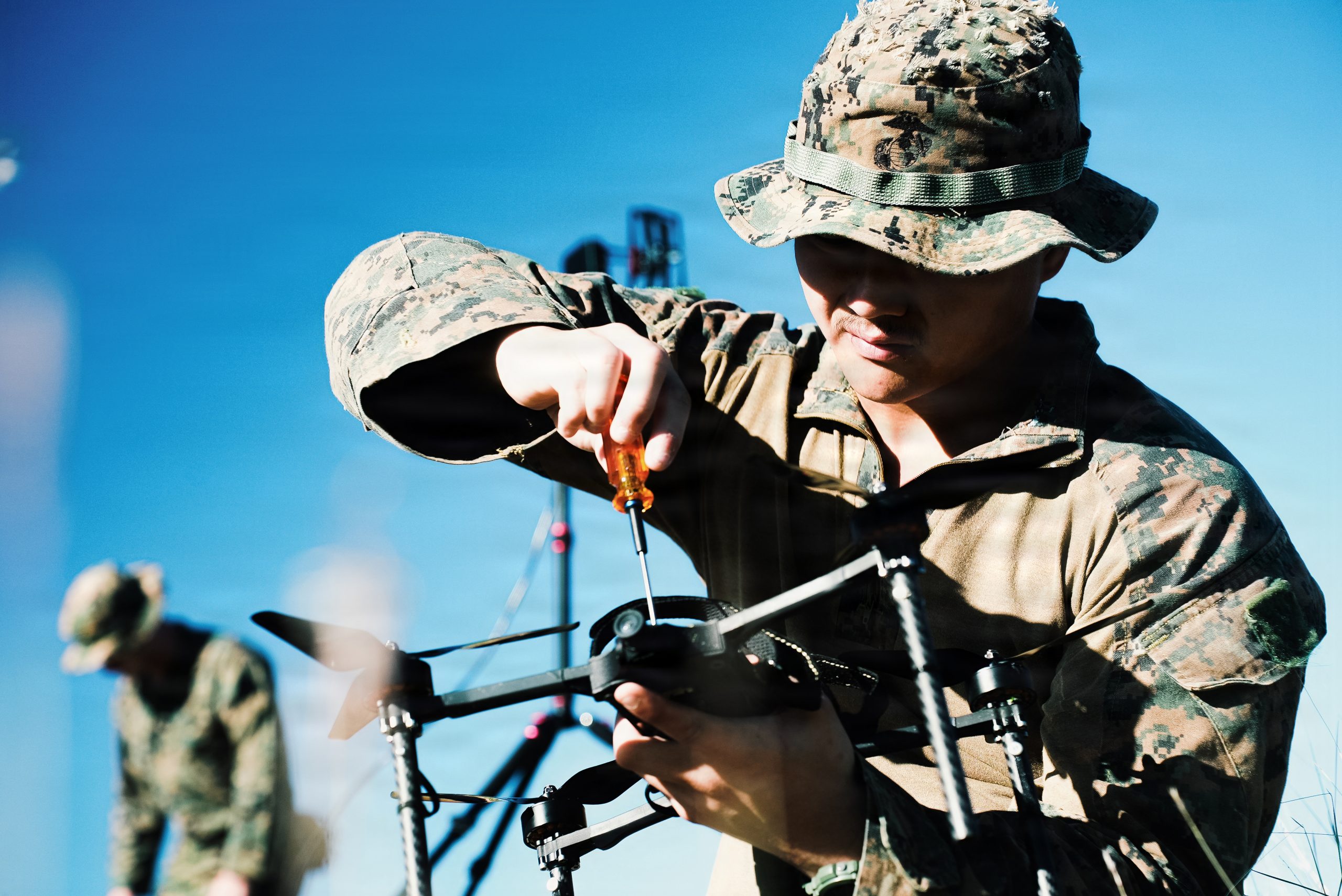 A U.S. Marine Corps rifleman with Weapons Company, Battalion Landing Team 3/6, 22nd Marine Expeditionary Unit (Special Operations Capable), prepares a Neros Archer first-person view drone during attack drone training on Camp Santiago, Puerto Rico, Nov. 22, 2025. 22nd MEU(SOC) Marines are being trained and certified by the 2d Marine Division and the Marine Corps Attack Drone Team on first-person view drone systems to enhance combat readiness. U.S. military forces are deployed to the Caribbean in support of the U.S. Southern Command mission, Department of War-directed operations, and the president's priorities to disrupt illicit drug trafficking and protect the homeland. (U.S. Marine Corps photo)
