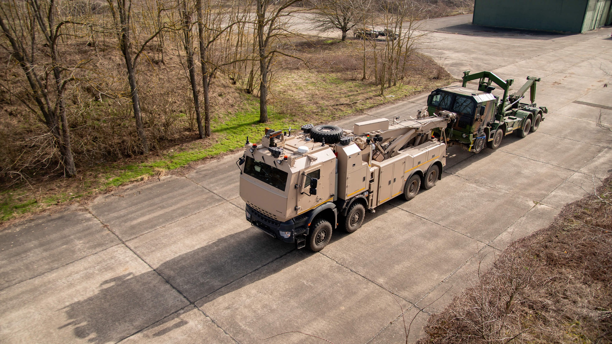 A Protected Recovery Vehicle towing a military system