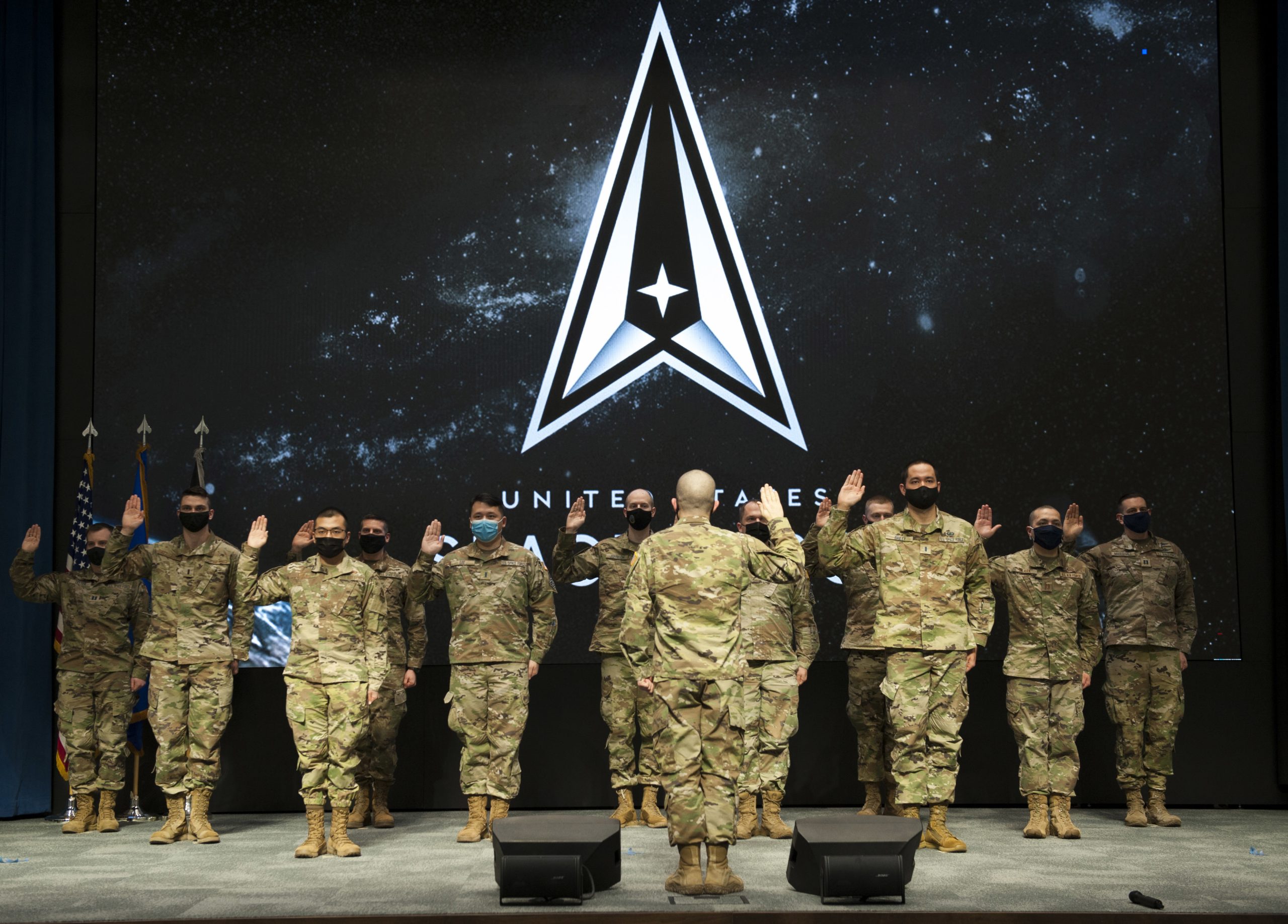 Service members take the oath of office officially transferring from the United State Air Force to the United States Space Force during a ceremony held at the Air Force Institute of Technology, Wright-Patterson Air Force Base Feb. 10, 2020. The Airmen transitioned into the Space Force as Guardians during the ceremony, joining some of the first Guardians to cross into the newest branch of the U.S. armed forces. (U.S. Air Force Photos by Senior Airman Caleb House
