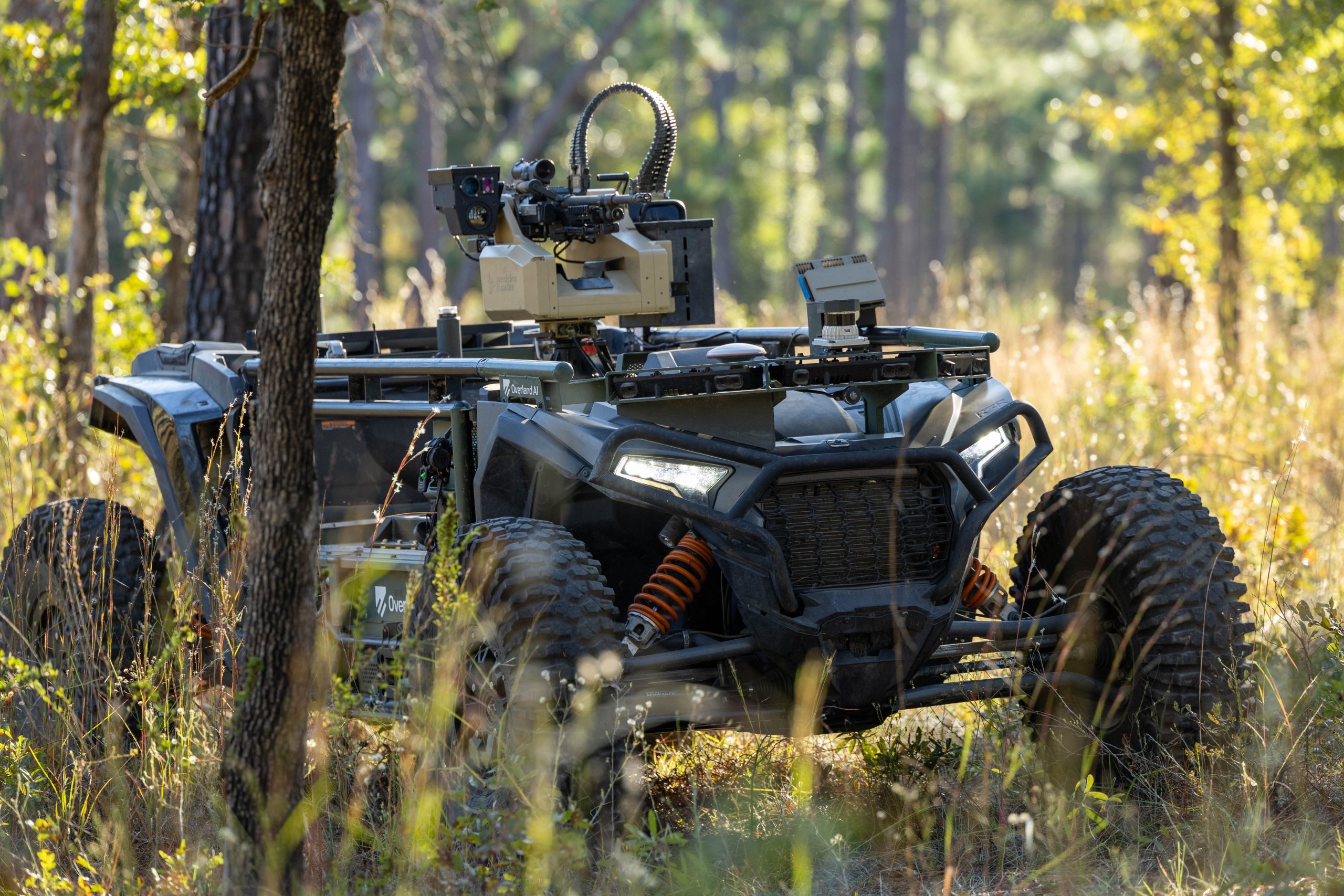 Overland AI’s ULTRA UGV maneuvers through wooded forest.