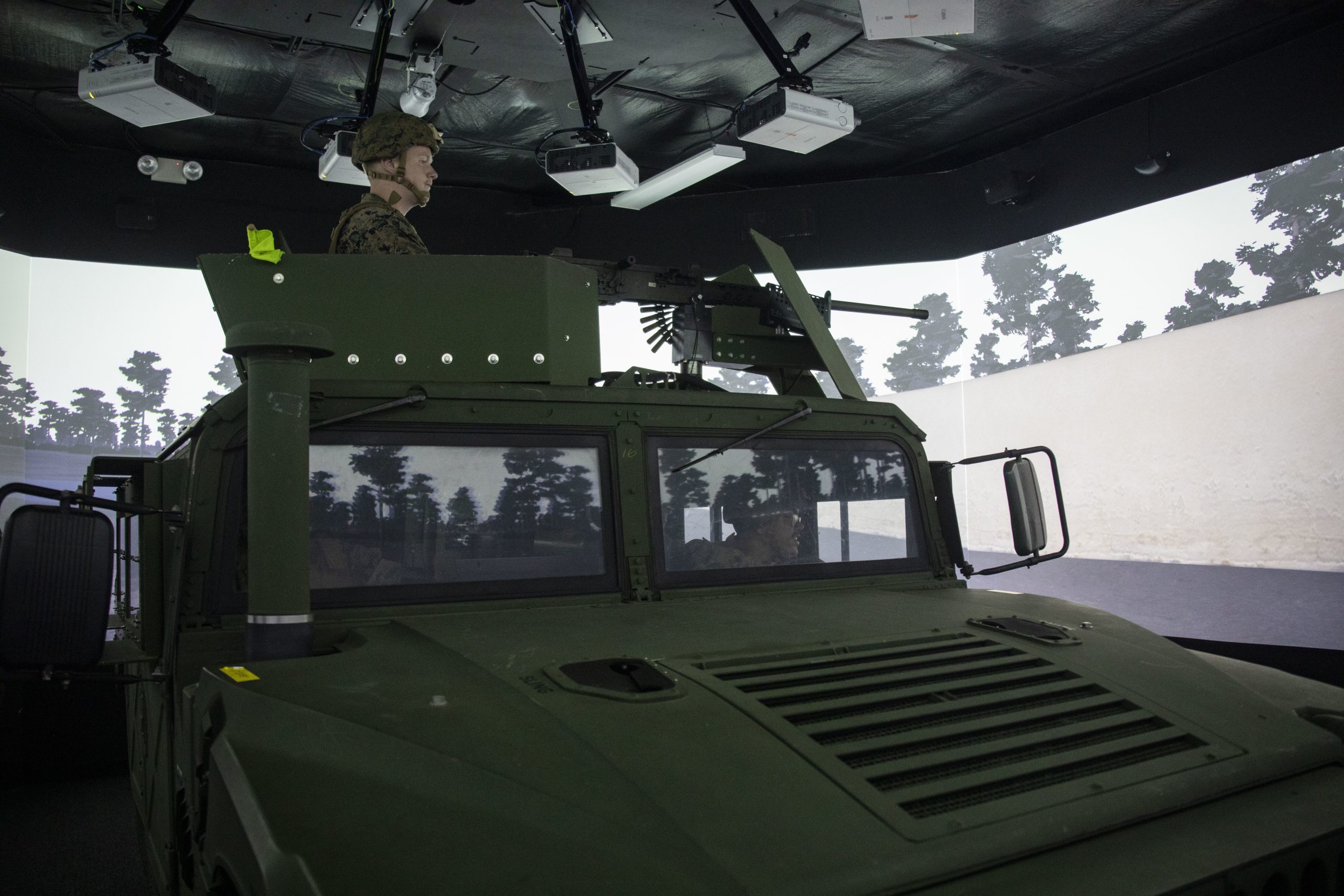 U.S. Navy Hospital Corpsmen with Bravo Surgical Company, 3d Medical Battalion, survey the surrounding area for hostiles during a convoy simulation, Marine Corps Base Hawaii, July 19, 2022. The purpose of the training was to familiarize hospital corpsmen on their additional duties when assigned to an operational unit, increasing readiness and proficiency. (U.S. Marine Corps photo by Cpl. Samantha Sanchez)