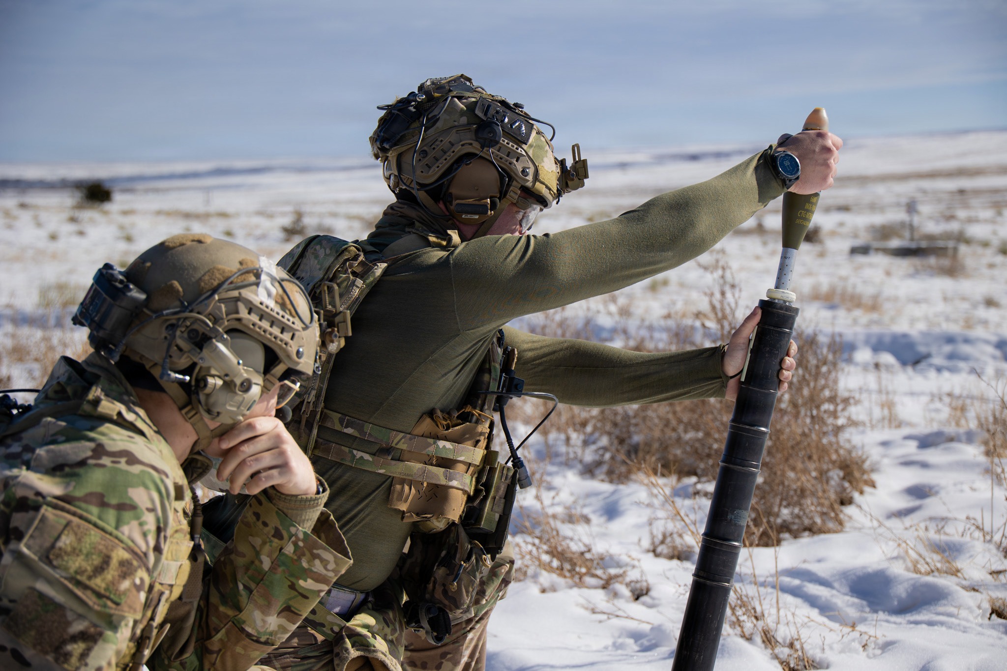 A Green Beret assigned to 3rd Battalion, 10th Special Forces Group (Airborne) hangs a 60mm mortar round from a M225A mortar system on a live-fire range. The live-fire range reinforced the Green Berets’ ability to operate in austere environments where indirect fire proficiency is critical to mission success and team survivability. (U.S. Army photo by Staff Sgt. David Cordova)