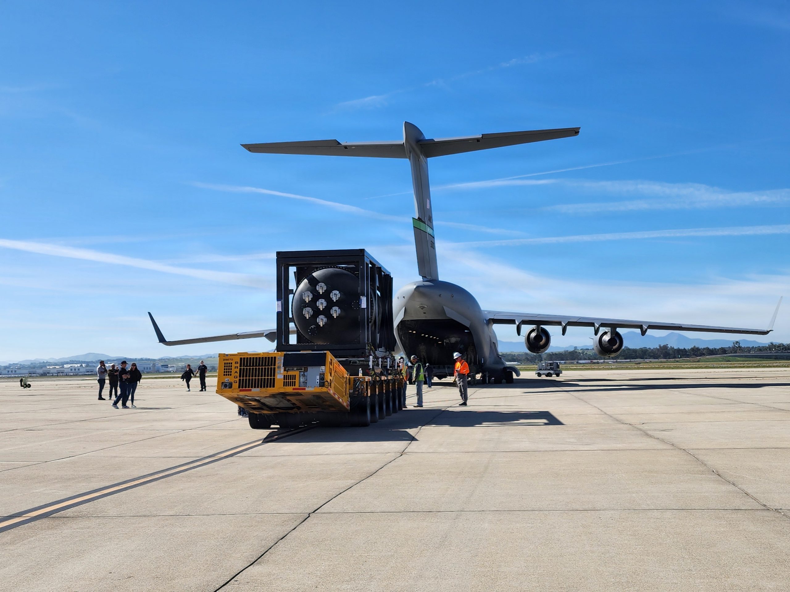 U.S. Air Force Airmen assigned to the 452nd Logistics Readiness Squadron Aerial Port Flight at March Air Reserve Base, California, support loading operations of a next-generation nuclear reactor onto a C-17 Globemaster III aircraft in support of Operation Windlord Feb. 15, 2026. The mission was conducted in coordination with Airmen from the 15th Airlift Squadron, 437th Airlift Wing, Joint Base Charleston, South Carolina, and the 62nd Airlift Wing, Joint Base Lewis-McChord, Washington. The aircraft transported the reactor to Hill Air Force Base, Utah, in support of a Department of War and Department of Energy partnership focused on nuclear energy testing and evaluation. (U.S. Air Force photo by Wendy Day)