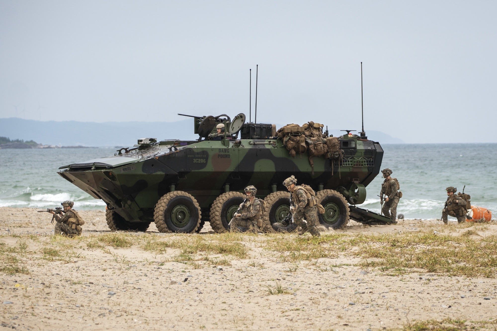 US Marines egress an Amphibious Combat Vehicle to secure the beach at Hwajin-ri, South Korea, during a simulated amphibious assault