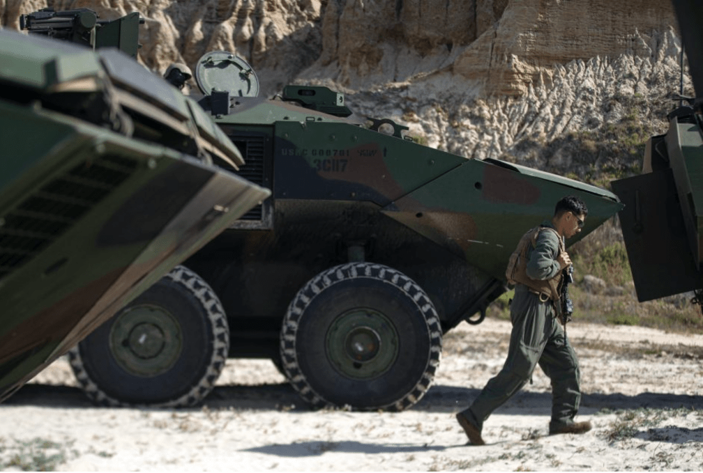 A U.S. Marine with the 3rd Assault Amphibian Battalion, 1st Marine Division, on shore after training at Marine Corps Base Camp Pendleton, California.