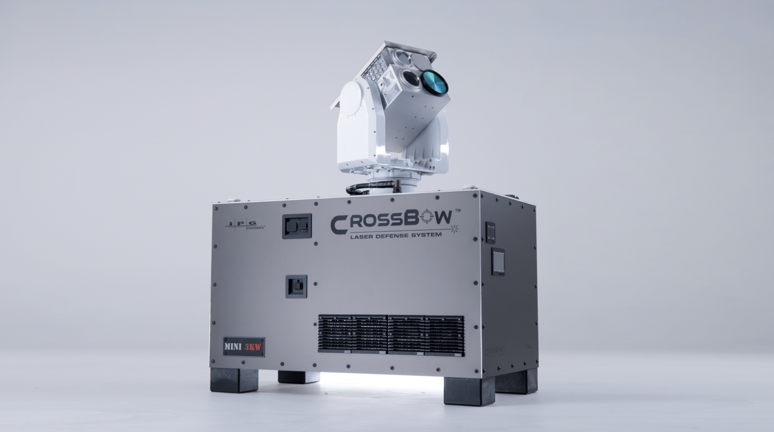 A compact laser defense system with a turret-mounted laser head, labeled 