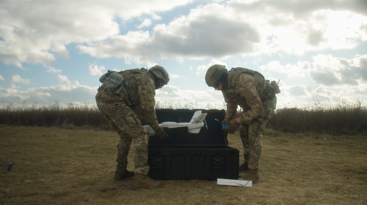 Soldiers handling a drone systems.