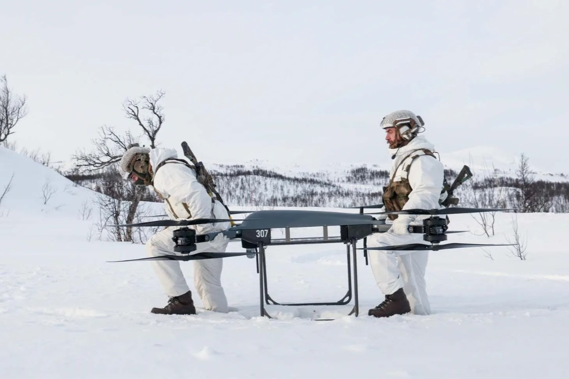 Troops moving the T150B drone.