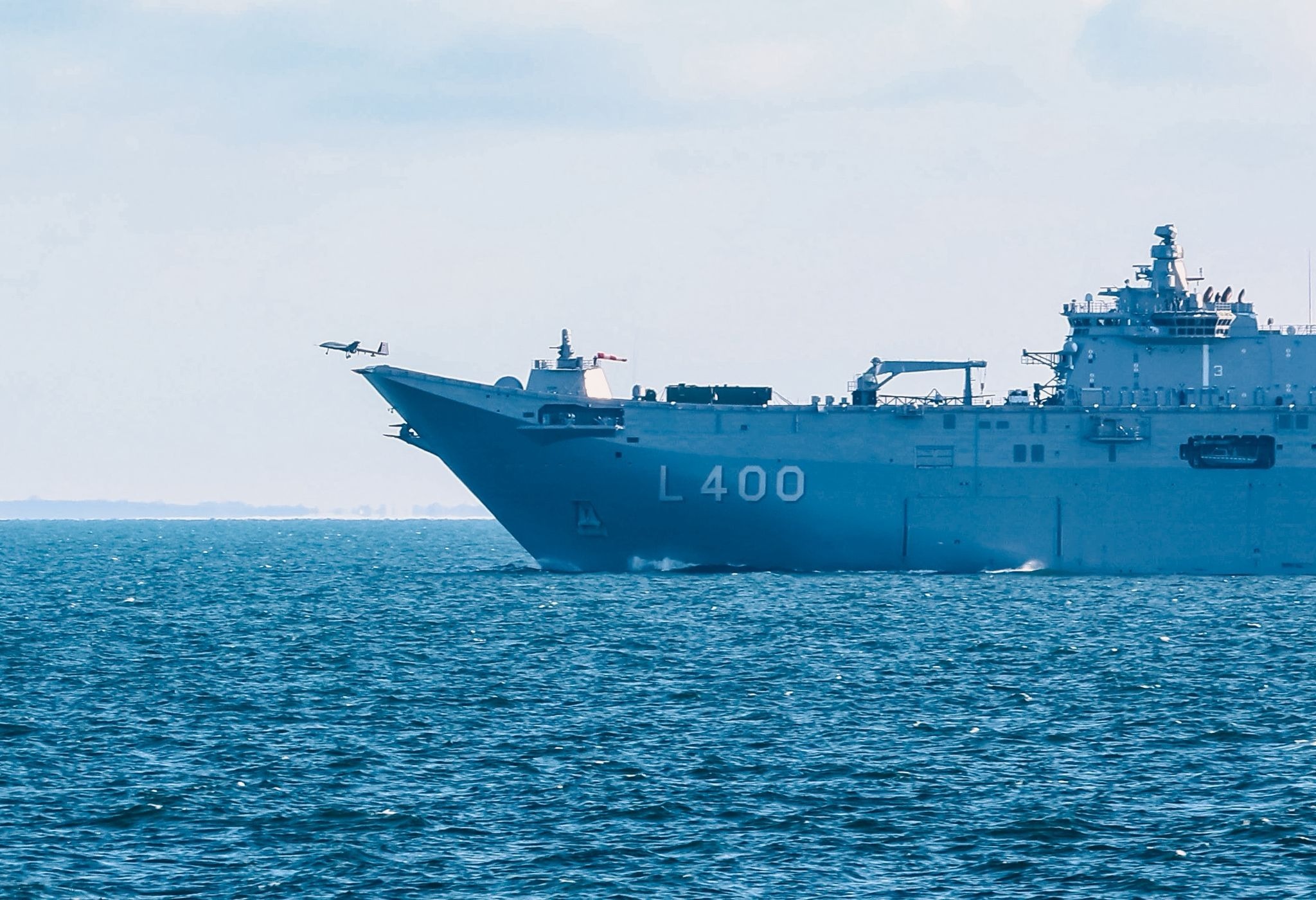 A Baykar Bayraktar TB3 UCAV launching from the TCG Anadolu carrier, marking a milestone in Turkish naval aviation and drone technology.
