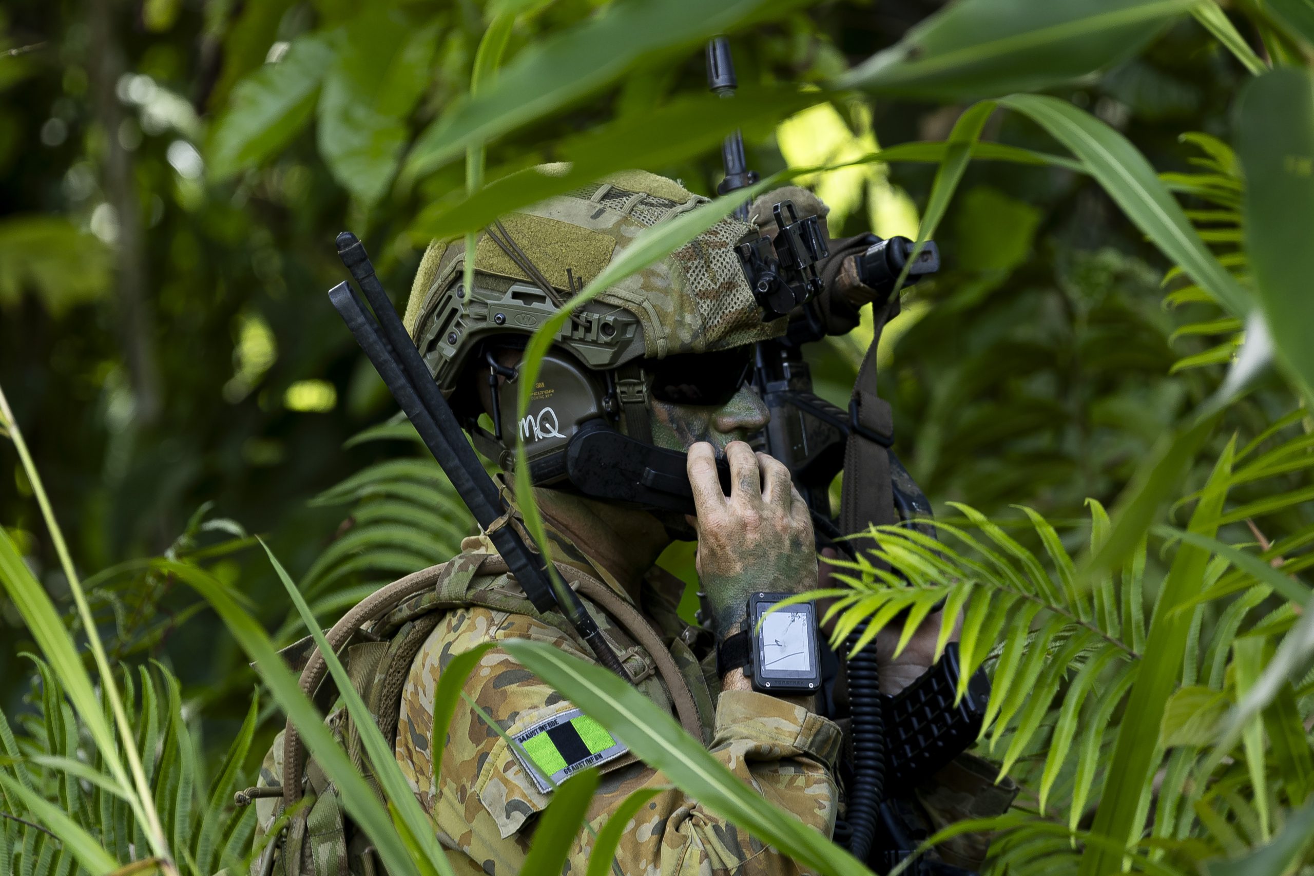 Australian Army officer Major Patrick Hoare from the 1st Battalion, The Royal Australian Regiment, radios information during an urban clearance of the Situm primary school as part of Exercise Wantok Warrior 25 in Lae, Papua New Guinea, on 18 October 2025. *** Local Caption *** Exercise Wantok Warrior is an annual training exercise held between the Australian Army and Papua New Guinea Defence Force in PNG. In 2025, around 300 soldiers conducted the exercise in Lae, completing infantry focused scenarios which include air-mobile and amphibious serials to enhance their skills and interoperability in a complex tactical setting. Exercise Wantok Warrior is a longstanding exercise and continues to build shared understanding, professionalism, and deepen the military relationship between both nations.